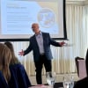 Picture of Jody Holland speaking to a group