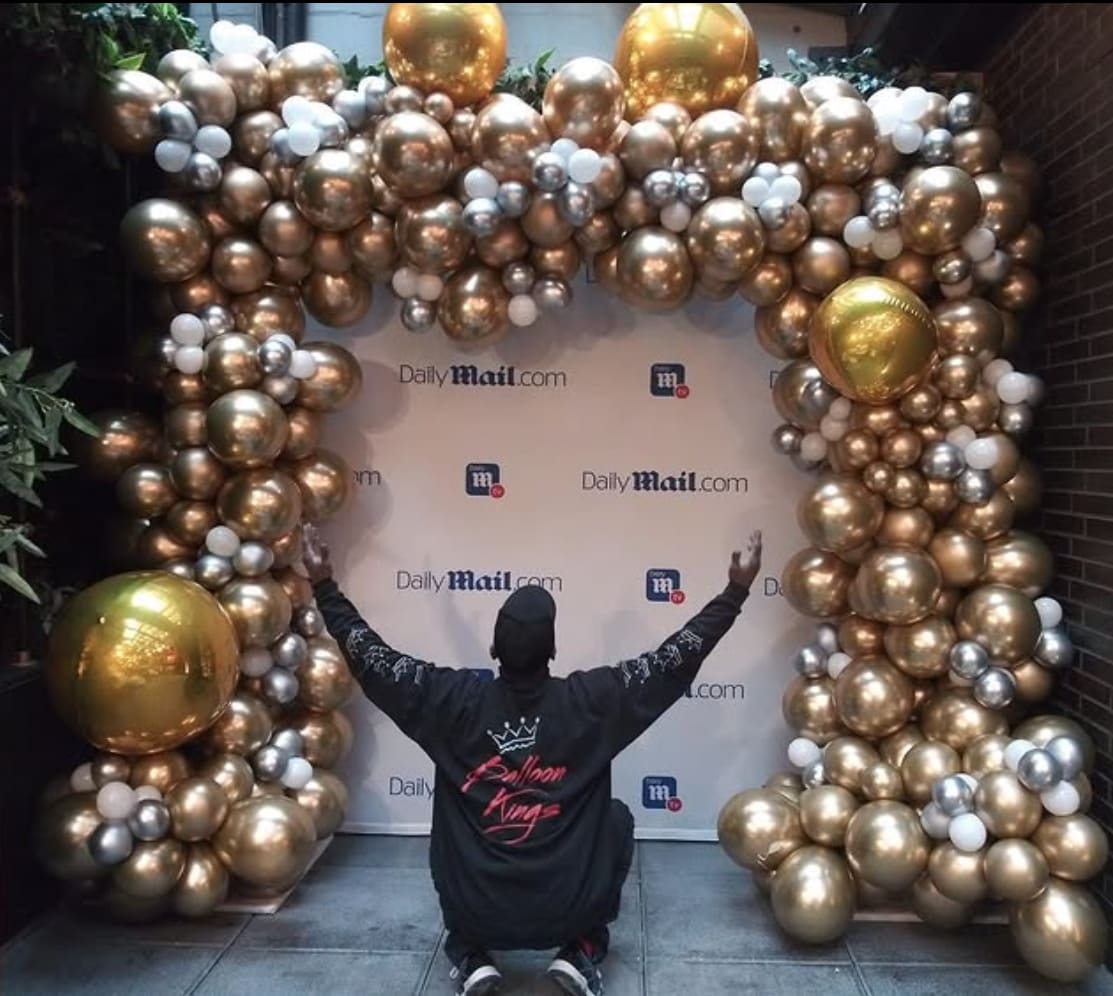 Gold and Silver balloon arch backdrop for a corporate event in Dallas.