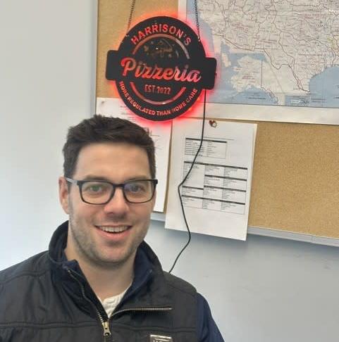 Harrison Collins pizza shop analogy sign