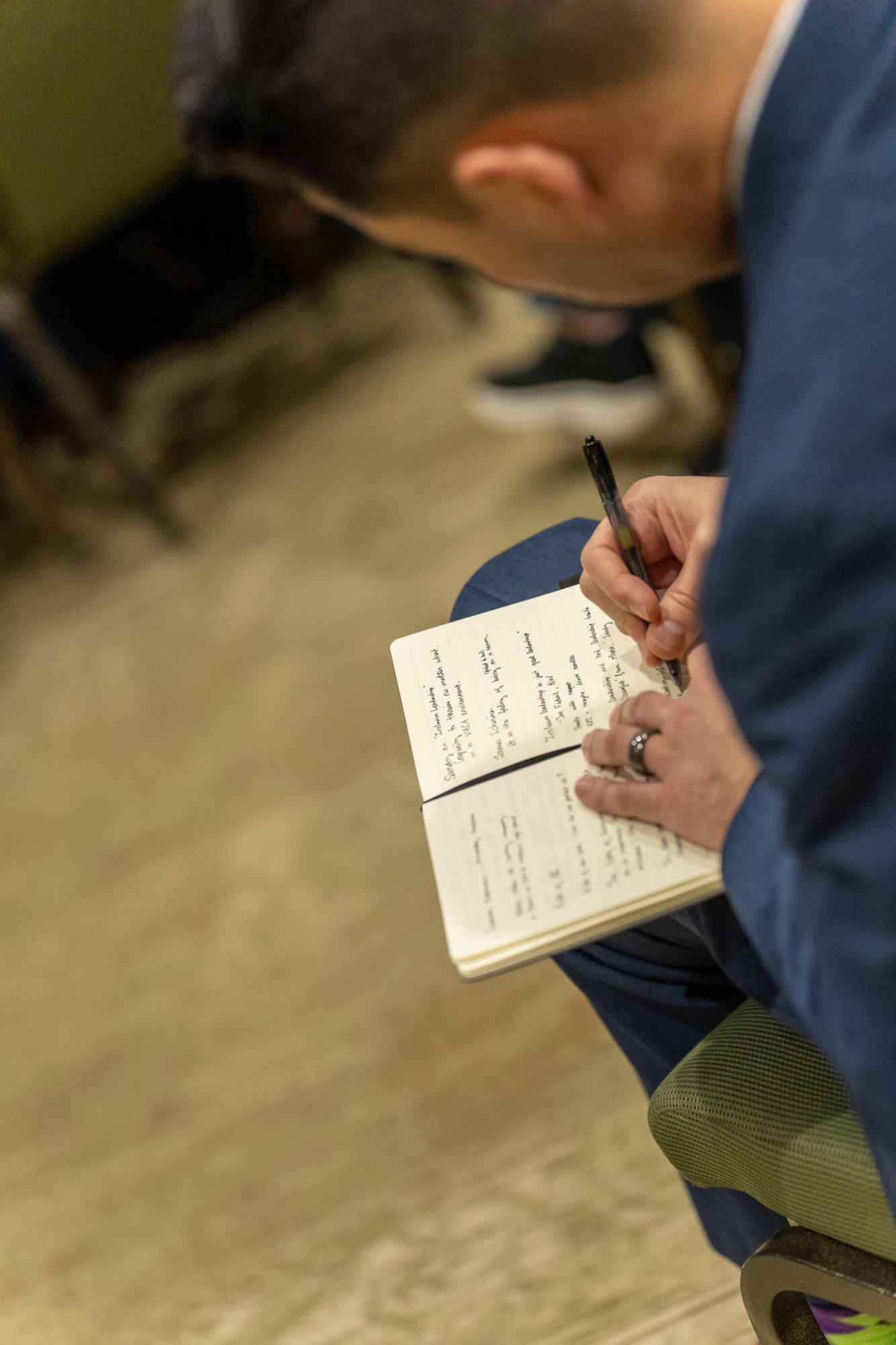 person writing in a notebook