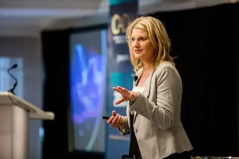 speaker on stage in front of an audience