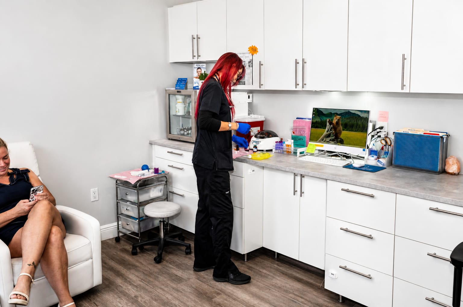 Refresh - Aesthetics & Wellness provider preparing supplies for a personalized wellness treatment in Florida