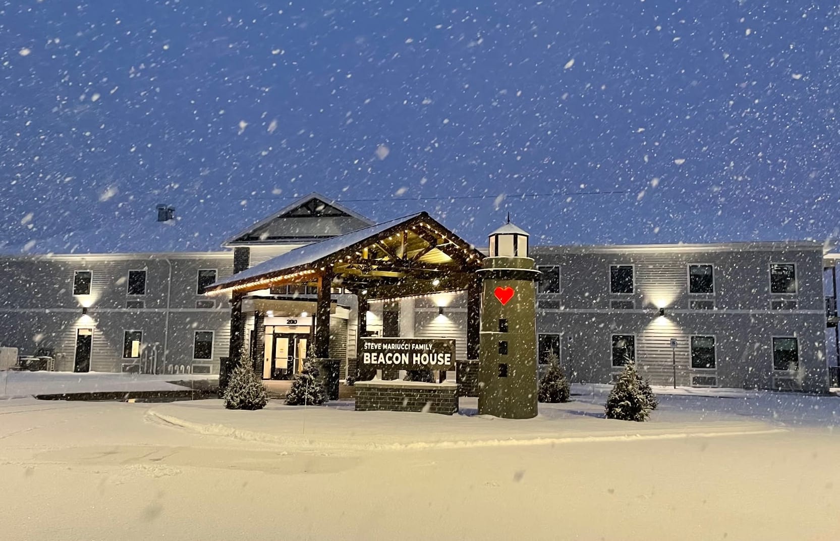 The front of Mariucci Family Beacon House in a snowstorm
