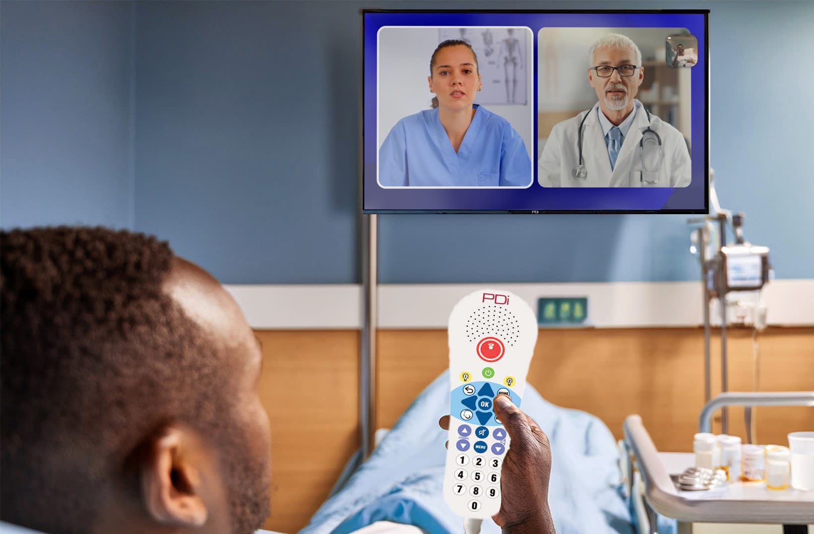 male patient in bed using pillow speaker to control PDi hospital TV