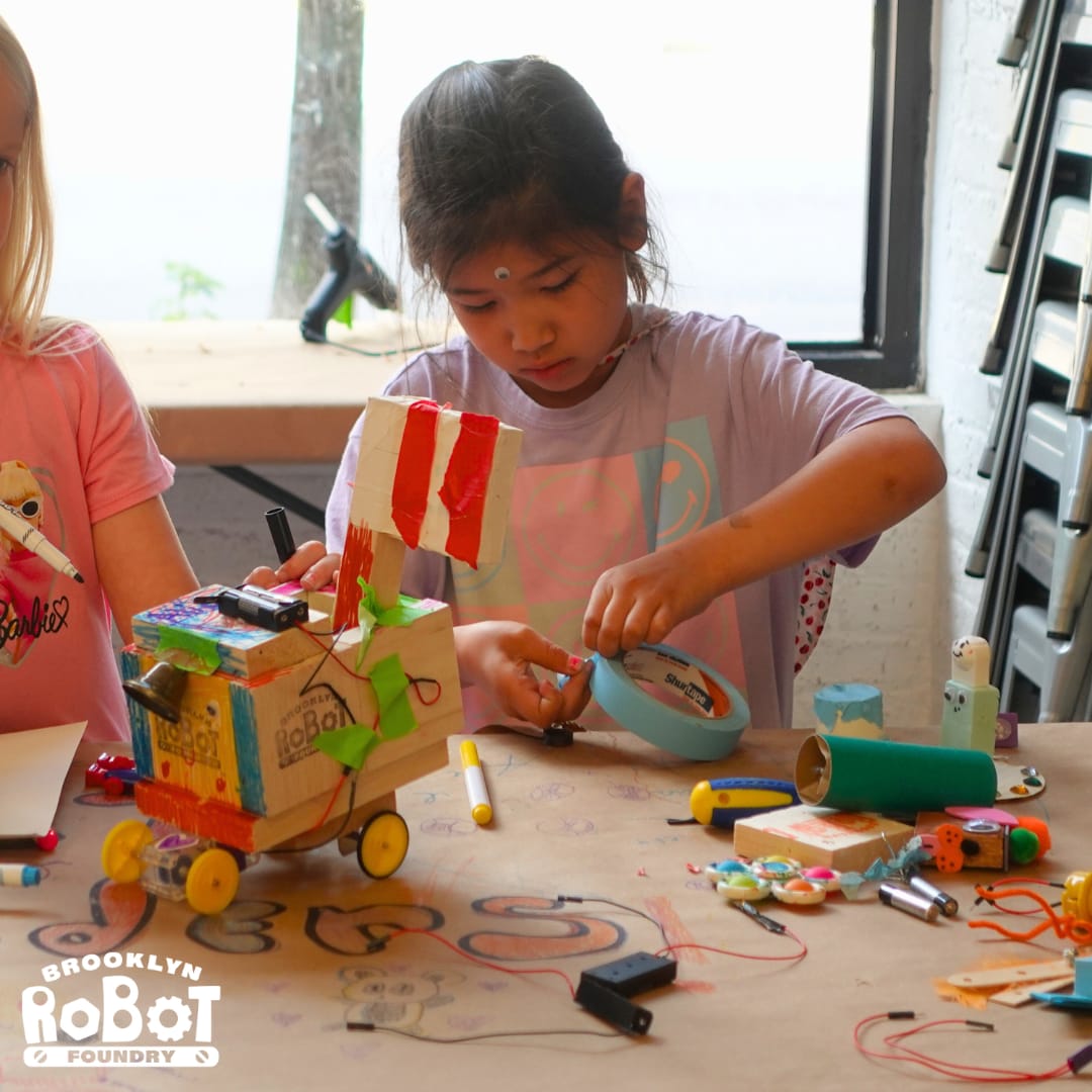 Girl Decorating with tape and markers