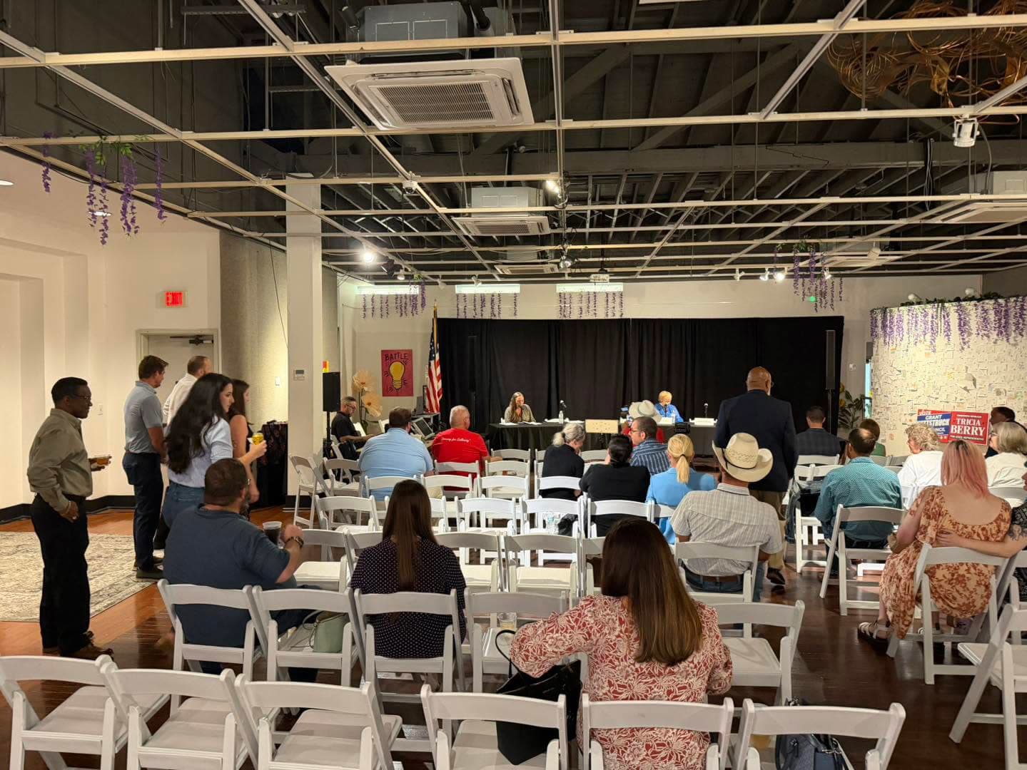 Attendees watch the Young Professionals Political Pulse candidate forum at the Panama City Center for the Arts.