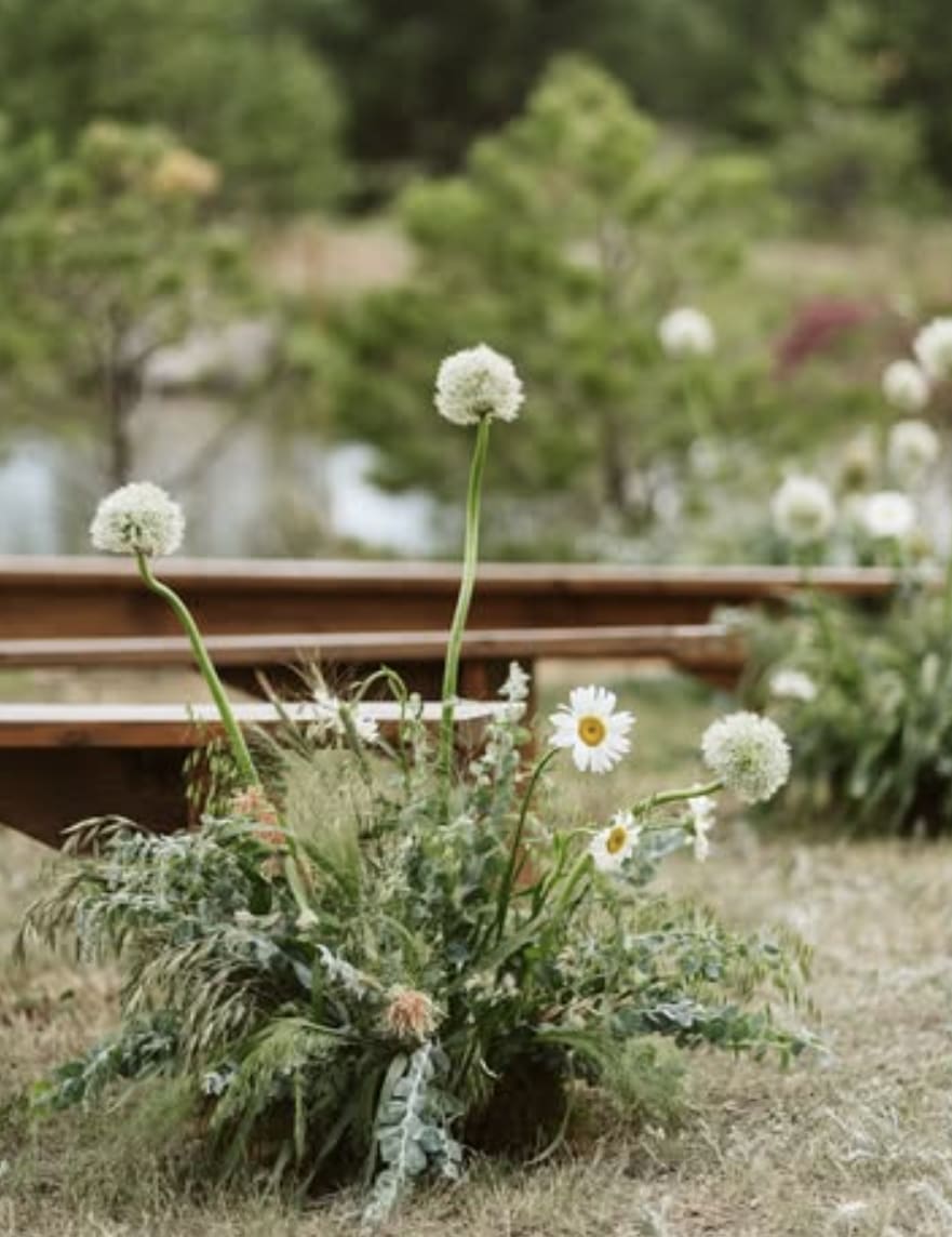 Whimsical and airy aisle ground floral pieces for ceremony aisle.