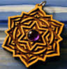LaserTrees laser cut wooden pendant with lotus and star patterns and a purple crystal in the center