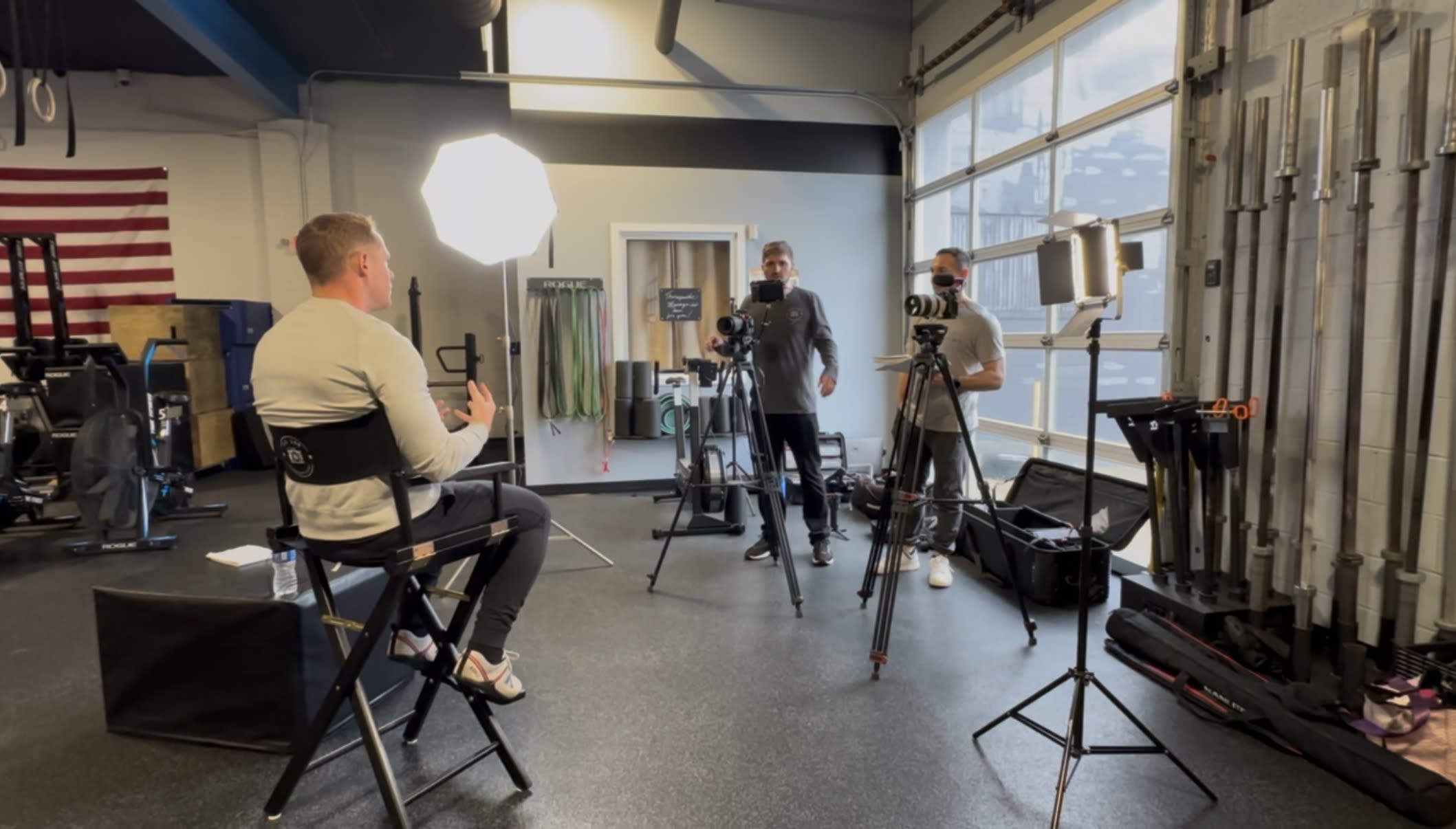 HD360 Productions video crew filming an on-camera interview at a client location with cinema cameras, professional lighting,