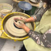 Student at the pottery wheel