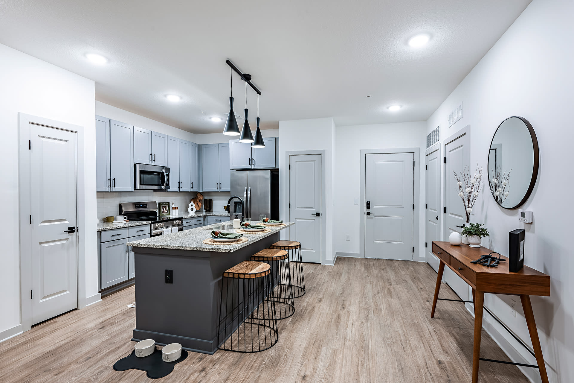 Spacious Kitchen with Granite Counters, Stainless Steel Appliances and Table-Sized Island