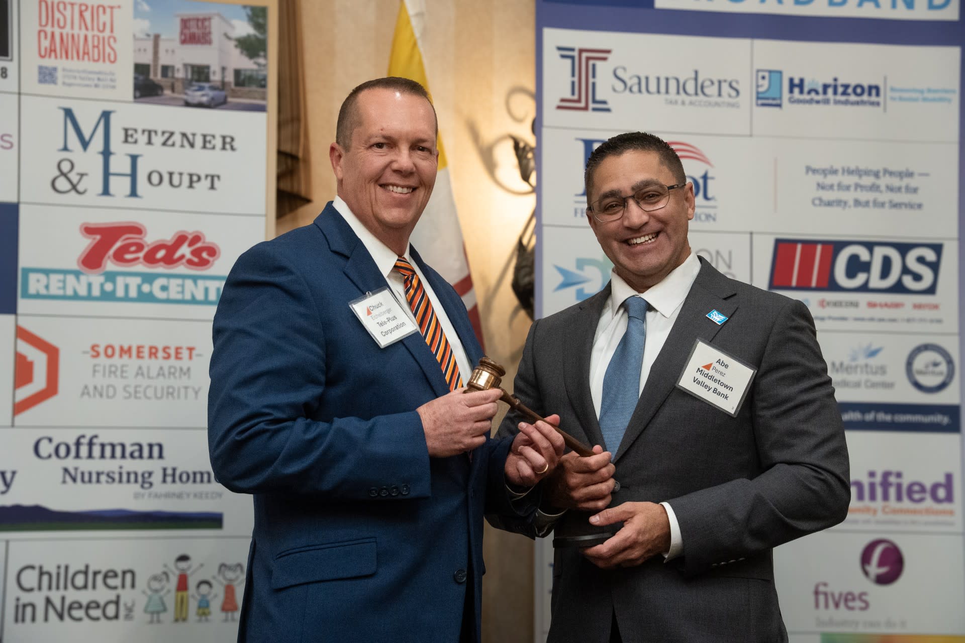 The Chamber's Immediate Past Board Chair passes the gavel to incoming fiscal year 2027 Board Chair