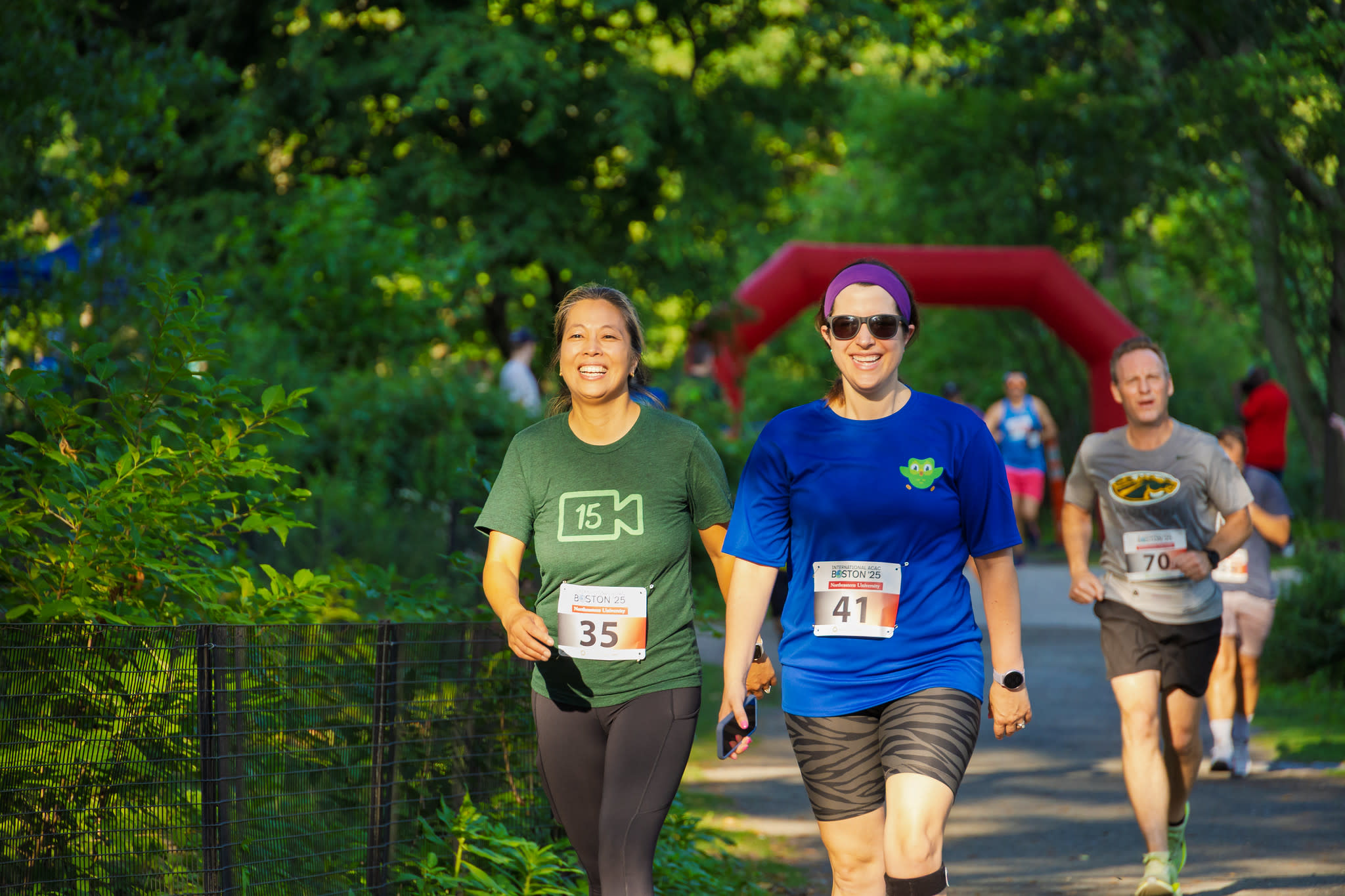 Two women walking the 5k course