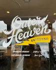 Outer Heaven Espresso on storefront window with yellow lightning bolt