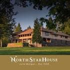 North Star House in Grass Valley surrounded by trees with an expansive lawn