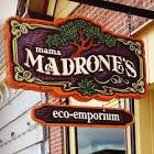 Mama Madrone's Eco-Emporium sign carved with a Madrone tree in the background in an ornate border