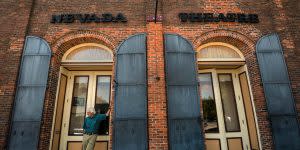 Nevada Theatre with brick building and shudders