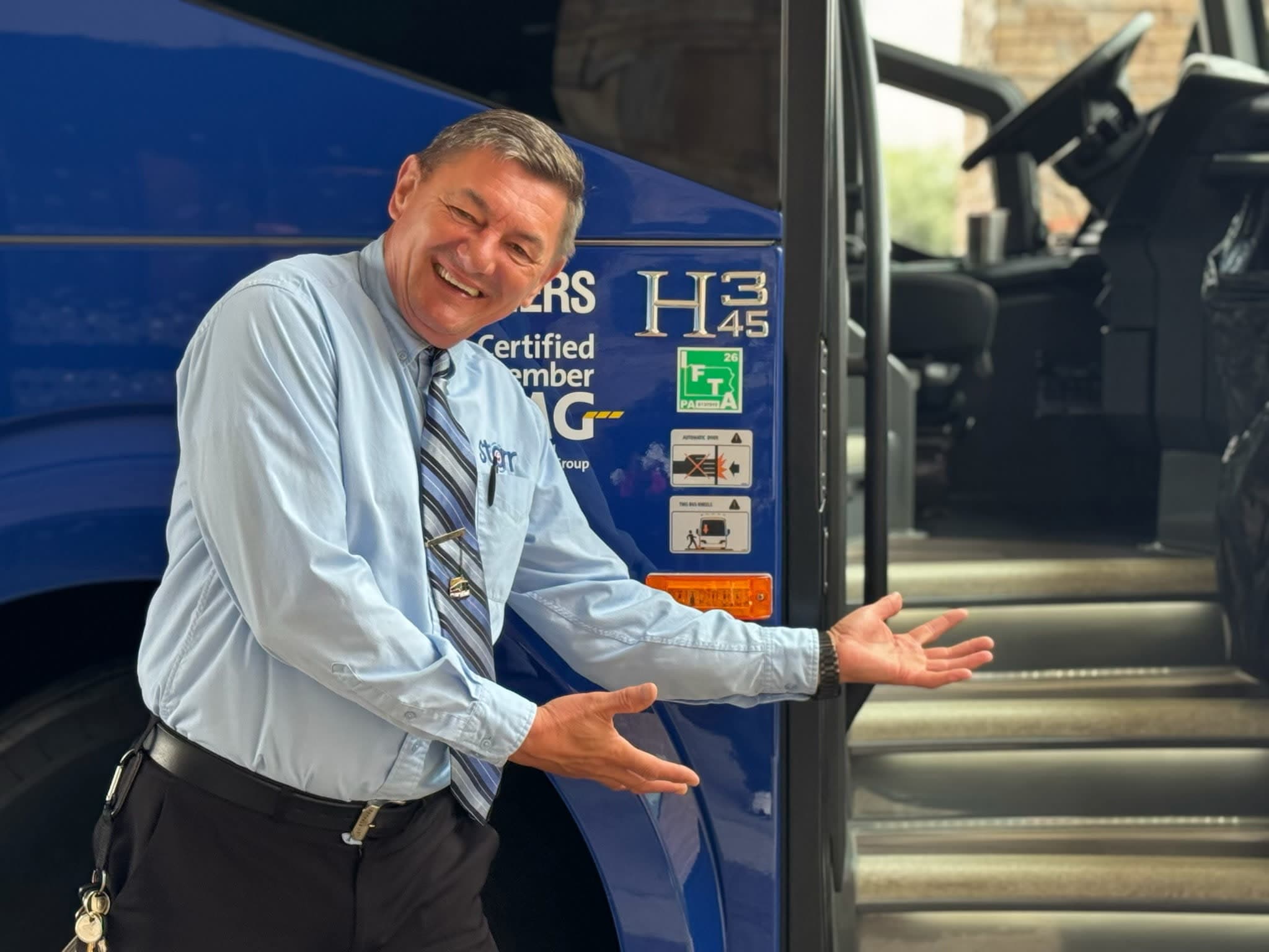 Starr Driver Welcoming Passengers Aboard Starr Motorcoach