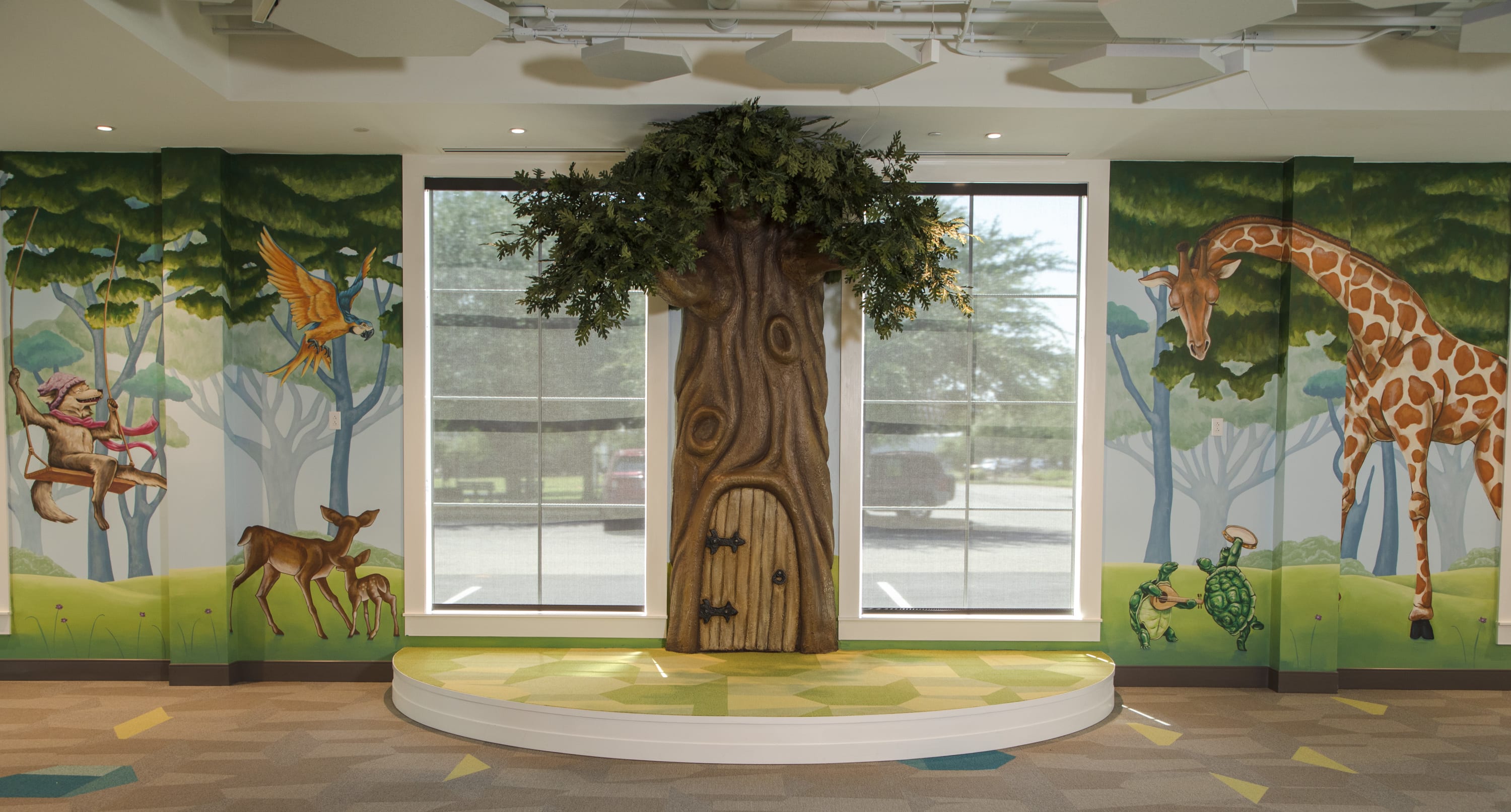 Foley Community Library children's murals and sculptural reading tree by Alabama mural artist Banks Compton