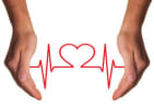 Two hands holding a heart line