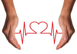 Two hands holding a heart line