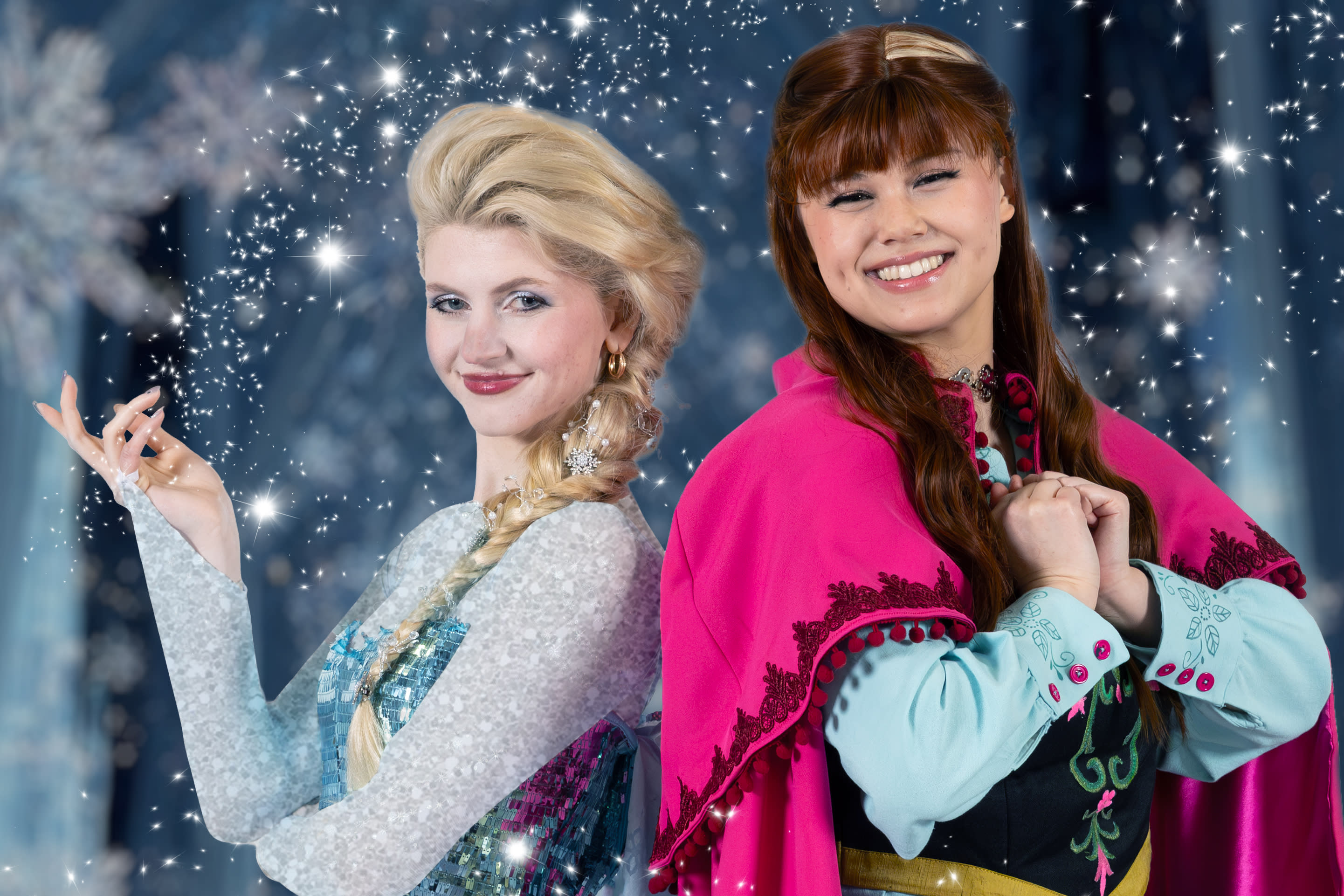 Elsa (Astraea Brown) poses back to back with her sister Anna (Lauren Berling)