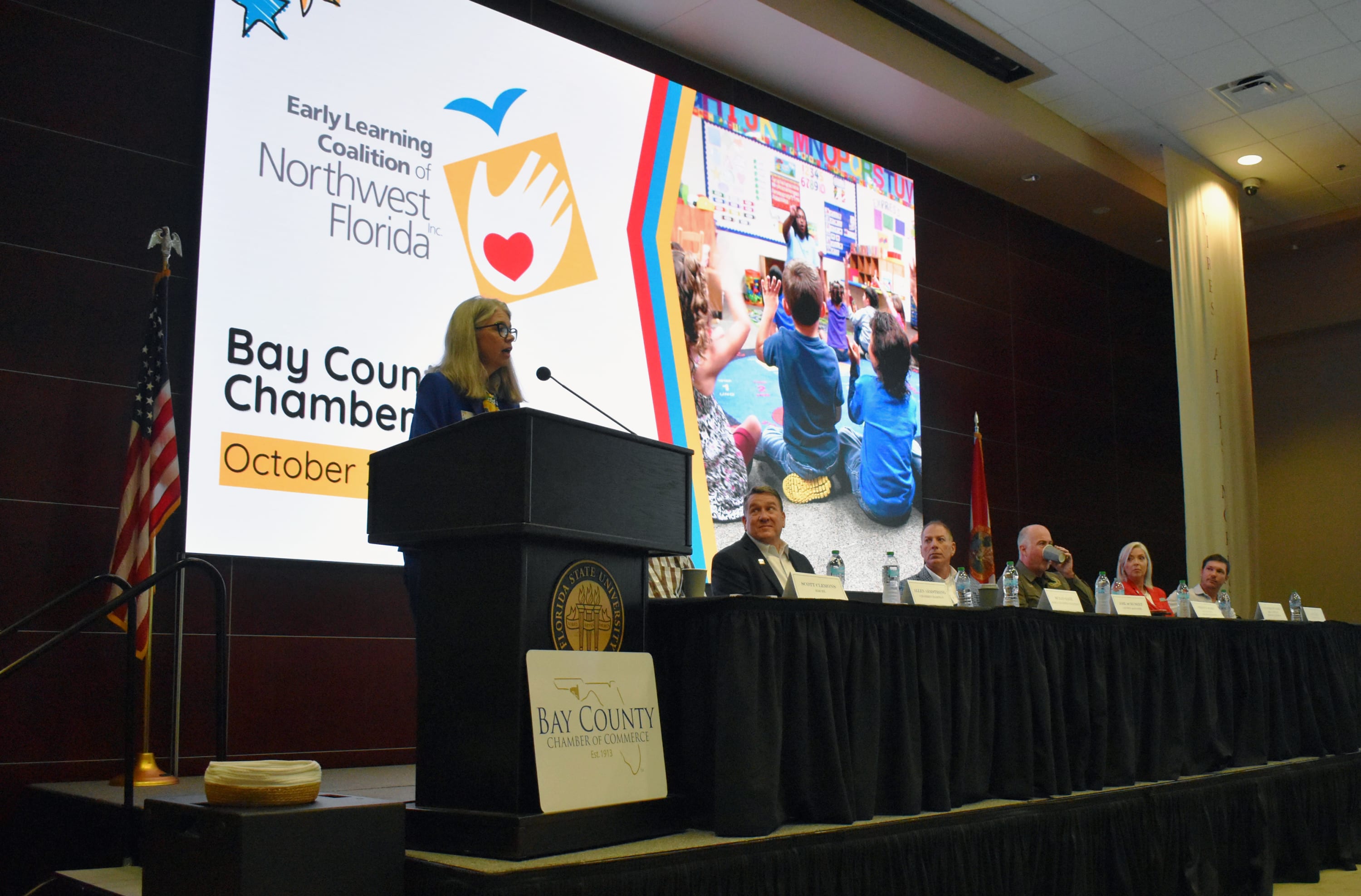 Suzan Gage, executive director of the Early Learning Coalition of Northwest Florida, speaks during October First Friday.