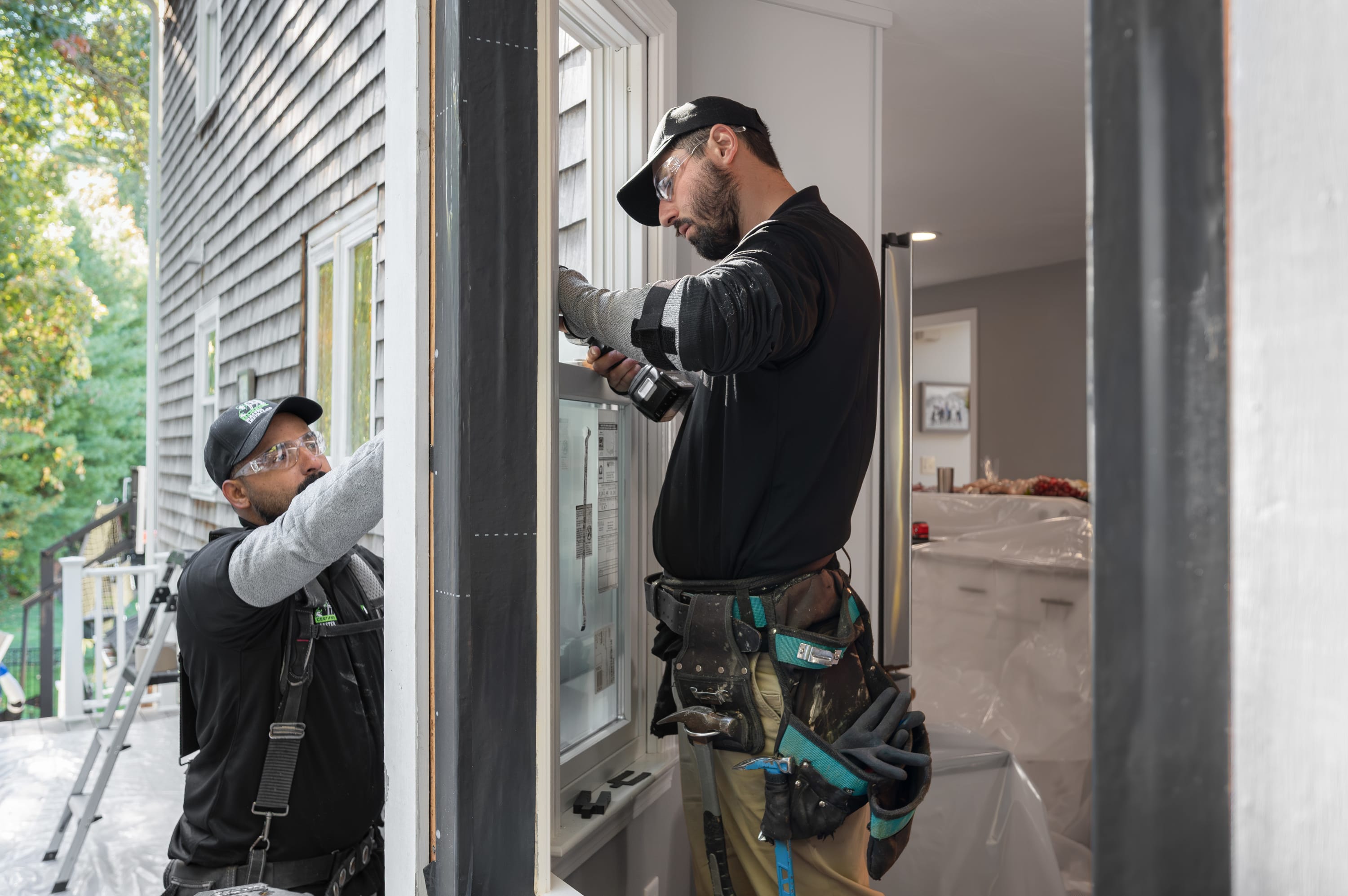 Renewal by Andersen certified master installers completing a double-hung window replacement for a local homeowner