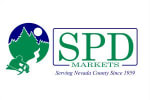 SPD Markets- Serving Nevada County since 1959- logo- a gold miner in green with Pine trees outlining navy sky with full moon