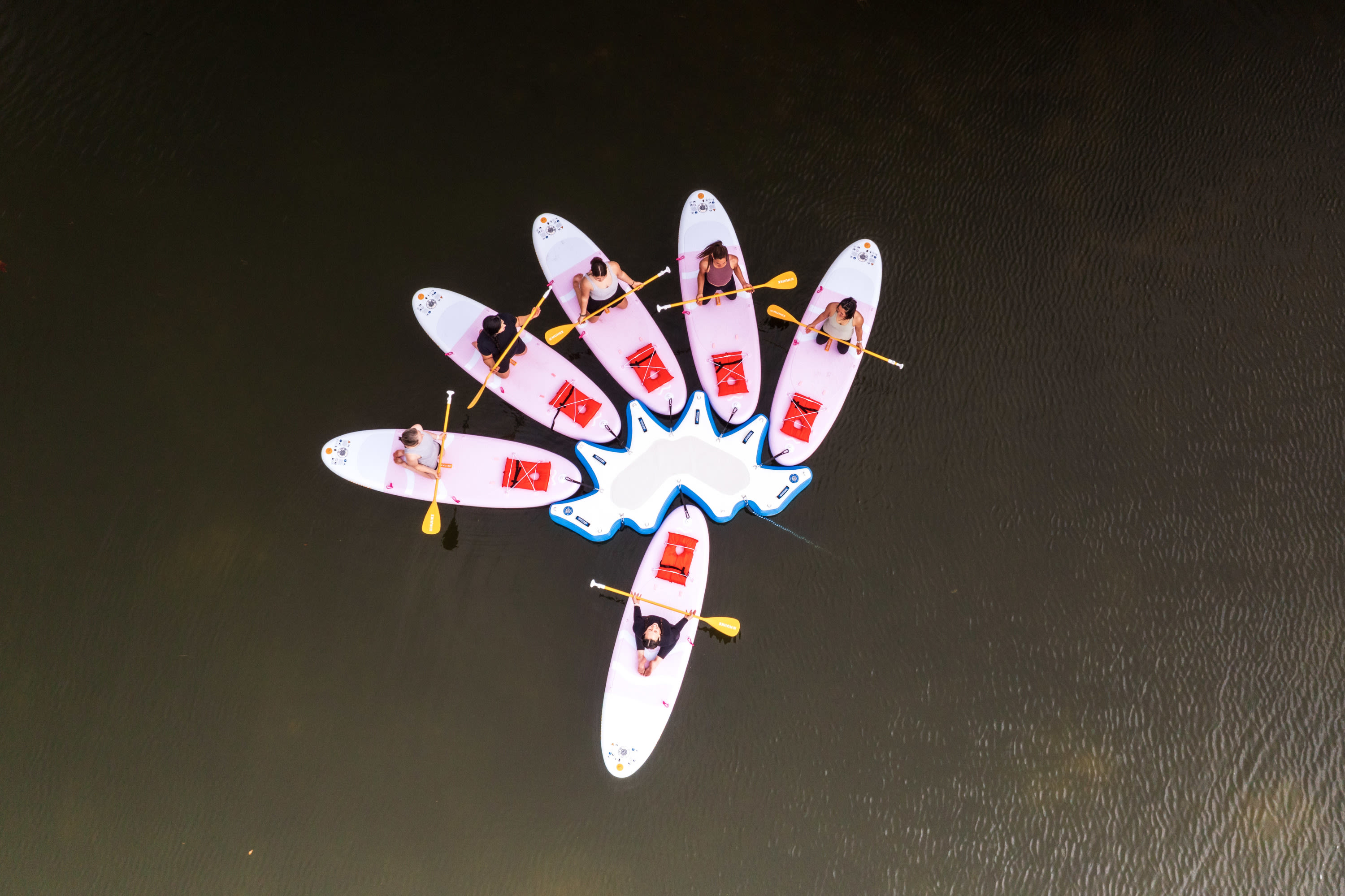 Group paddleboard fitness class at Lake LBJ