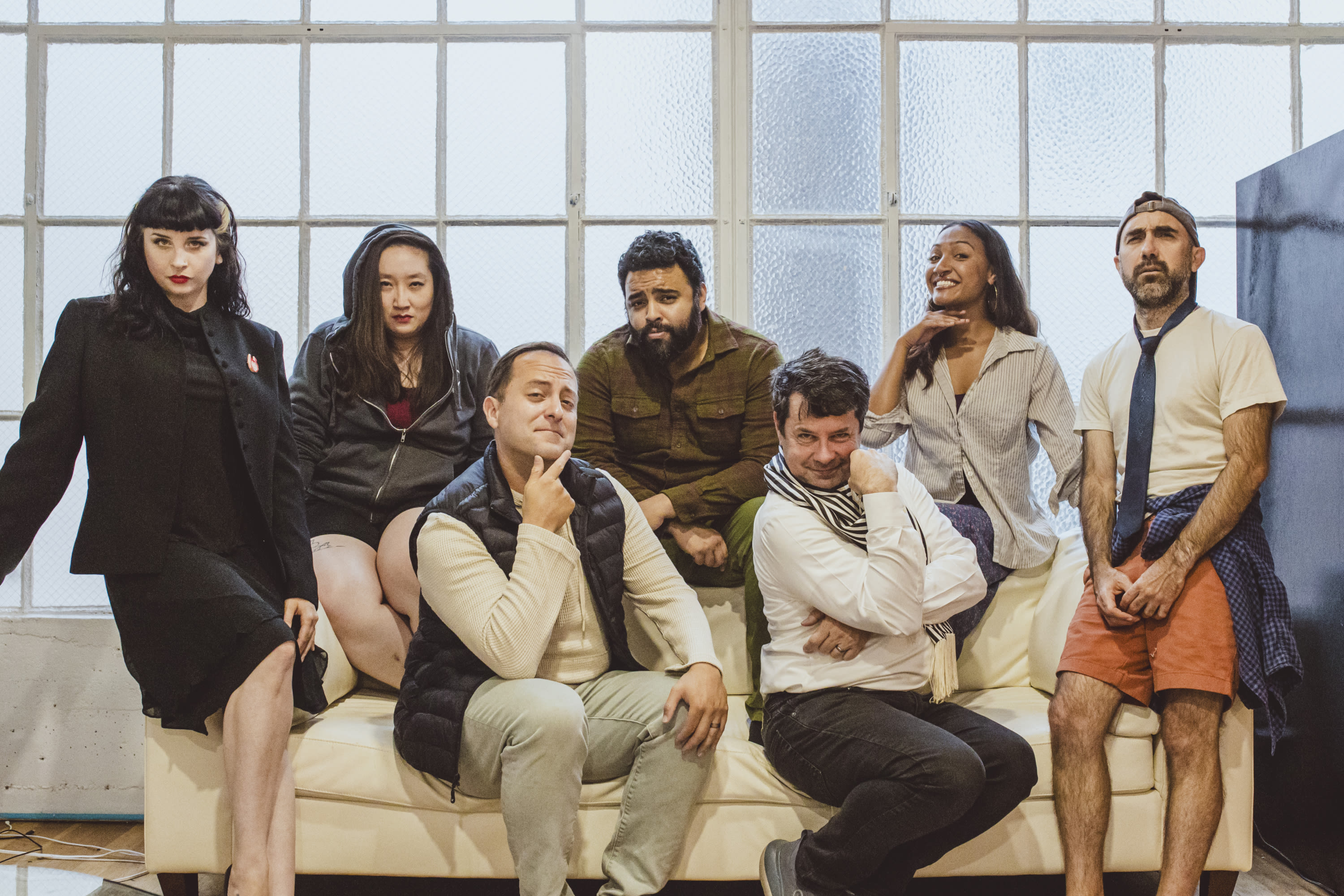 Cast photo with actors posing