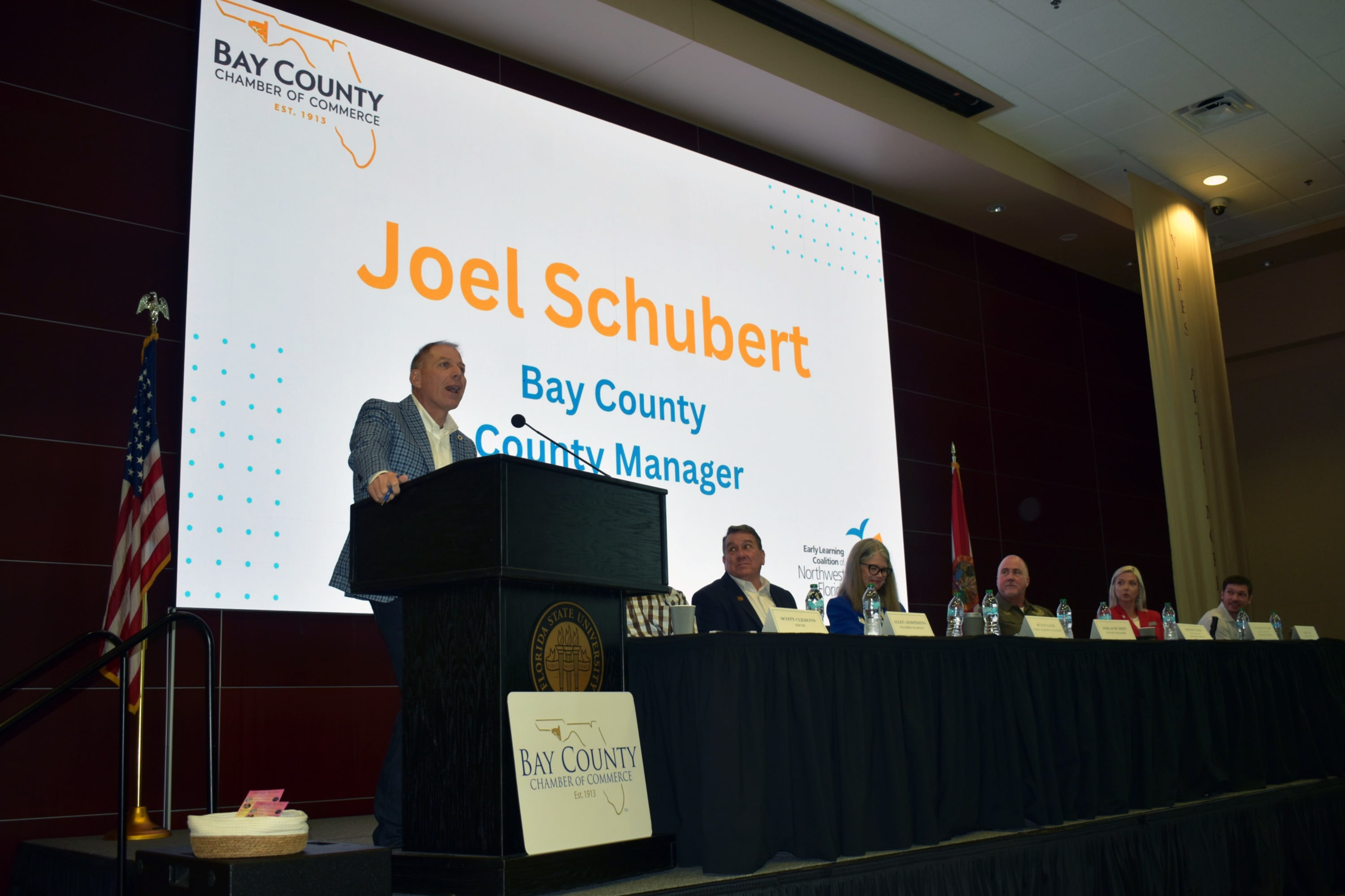 Bay County Manager Joel Schubert speaks during the Bay County Chamber's October First Friday program.