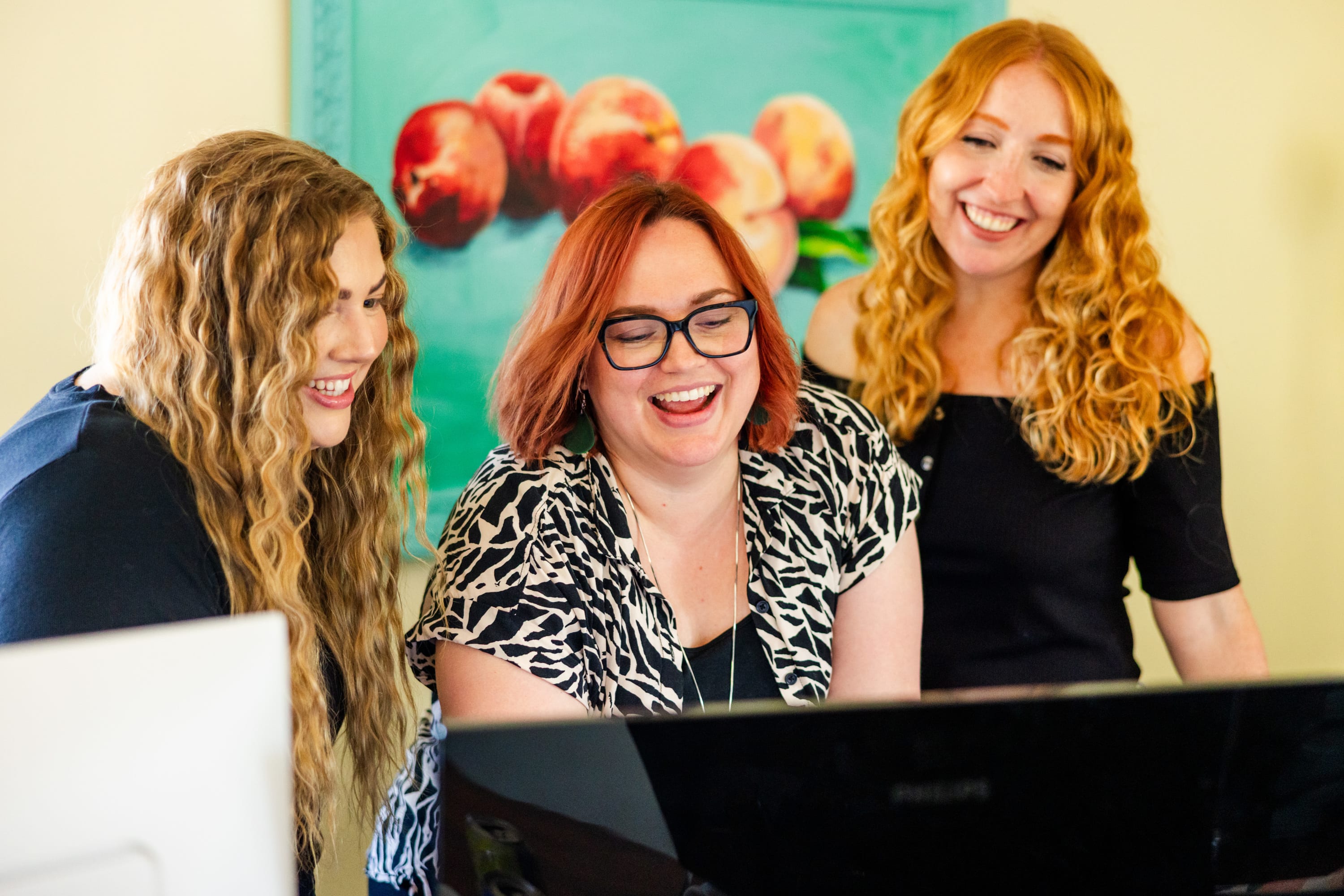 Girls looking at a computer
