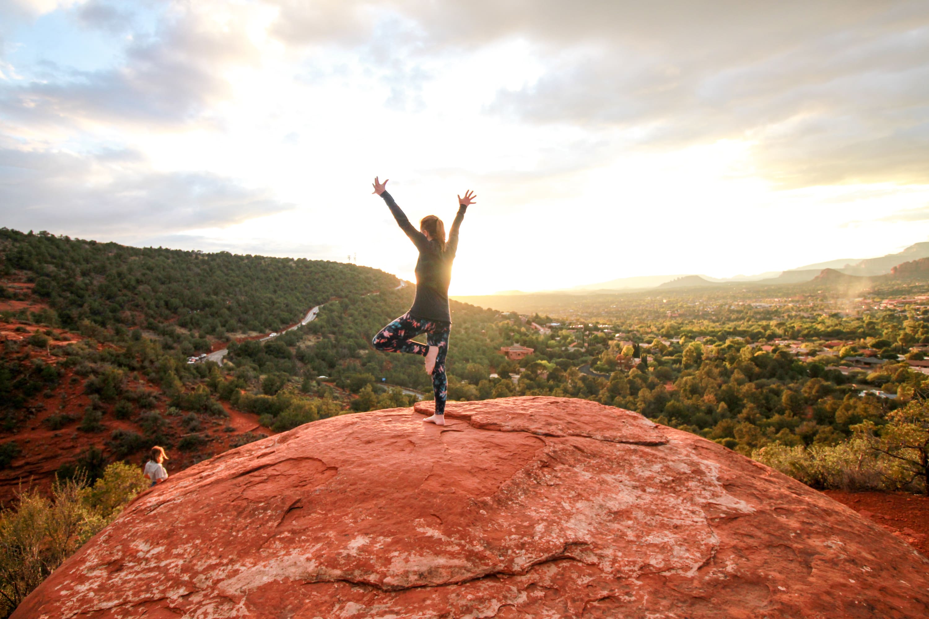 A woman doing yoga in the vortex on a Sedona Yoga retreat with Vita Pura Yoga