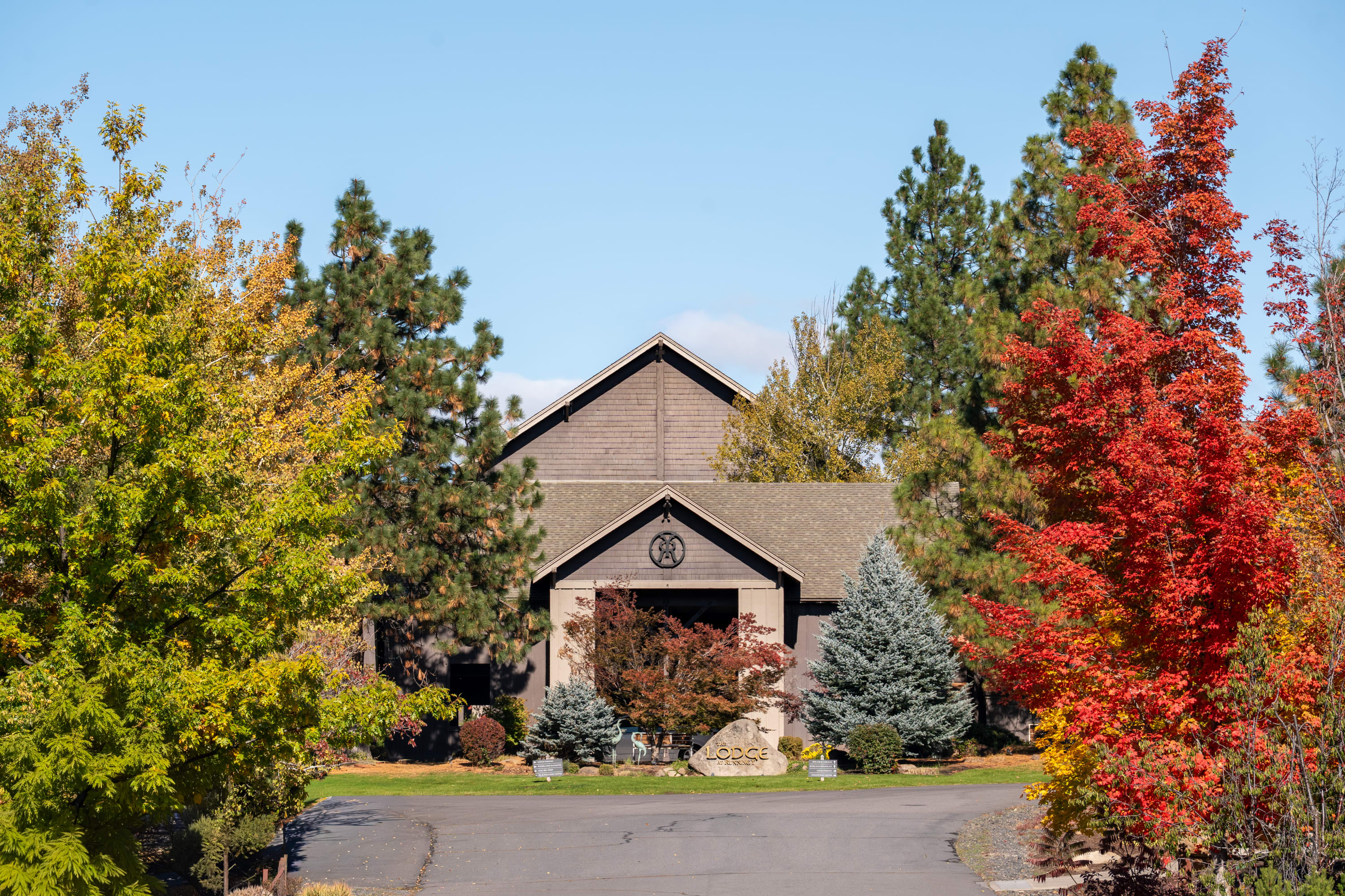 Front entrance of Running Y Resort surrounded by colorful fall foliage in Klamath Falls, Oregon
