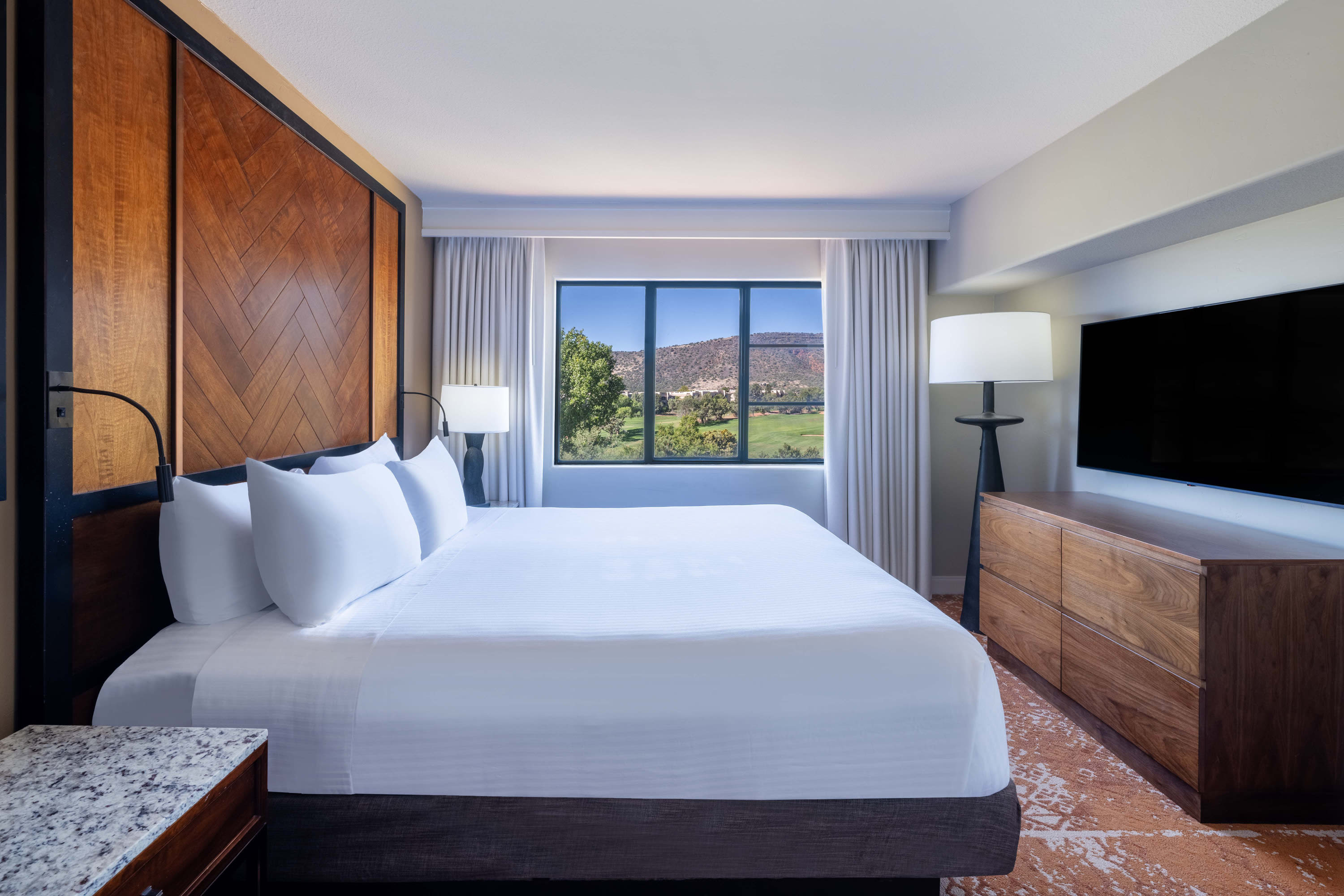 Spacious one-bedroom king suite featuring a king-size bed and modern décor.