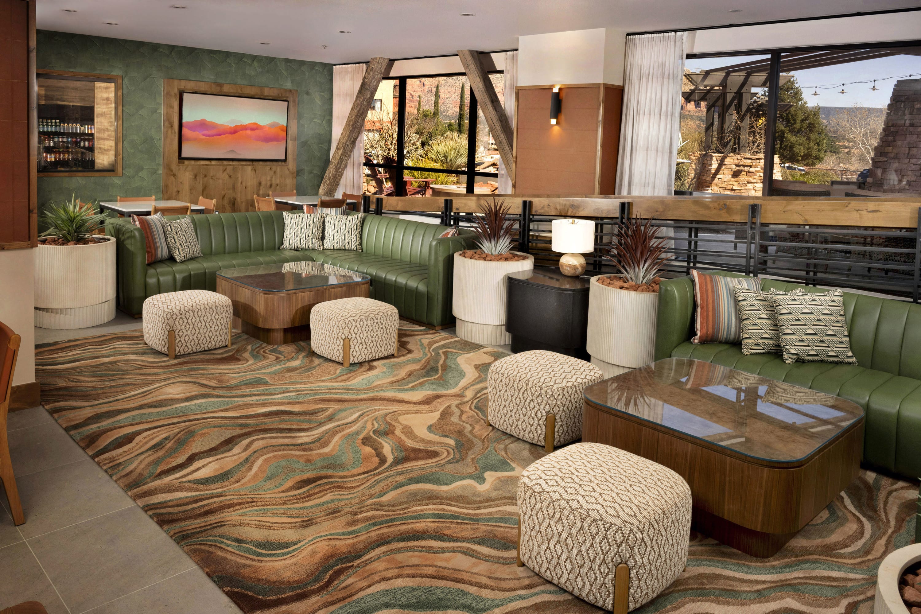 Resort lobby featuring a warm and welcoming seating area with large windows and southwest decor.