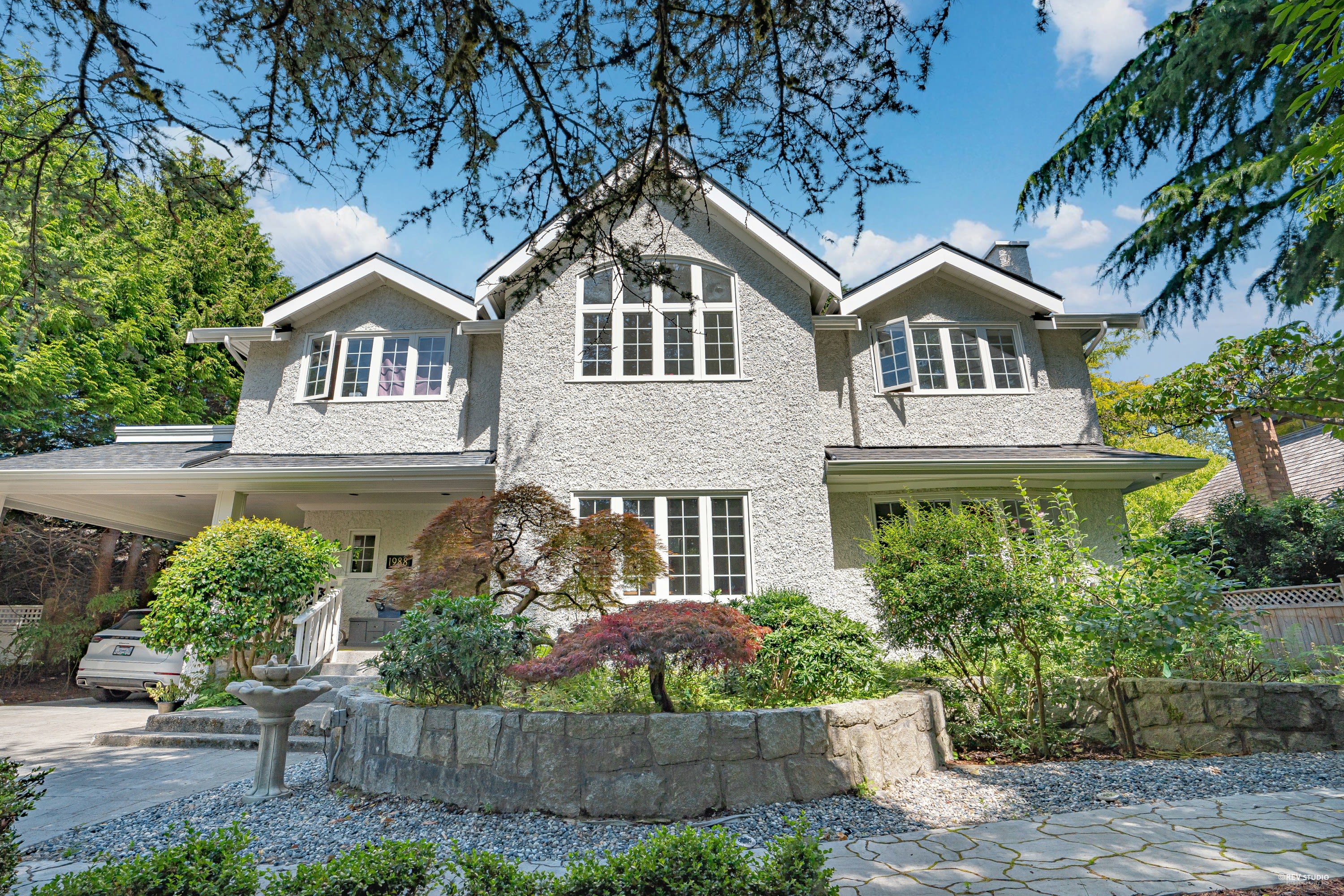 Renovated heritage home at 1988 Acadia in the University Endowment Lands, featuring restored exterior character, mature lands