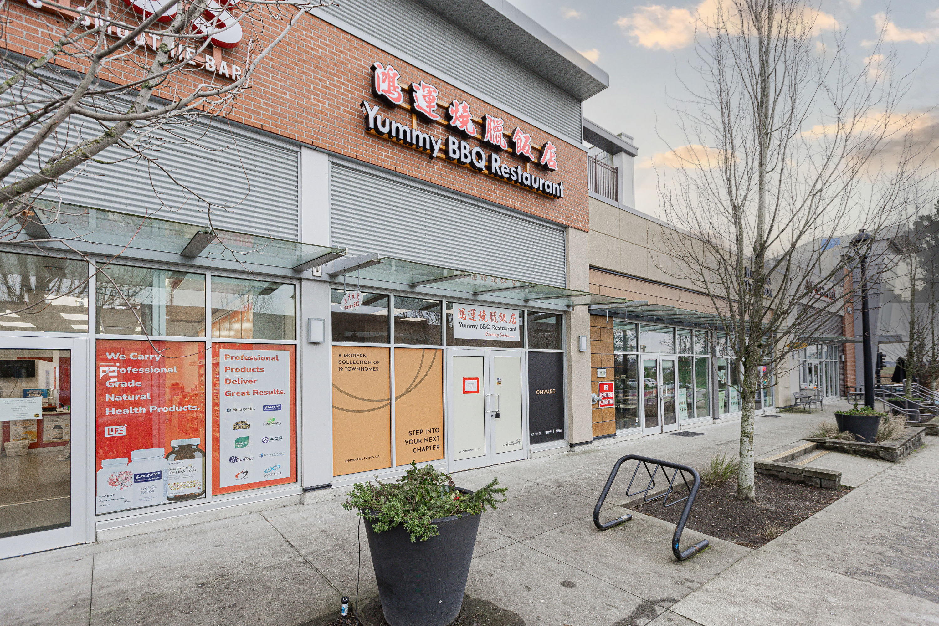 Exterior storefront of Yummy BBQ Restaurant in Richmond, featuring commercial signage, glass entry doors and a street-facing