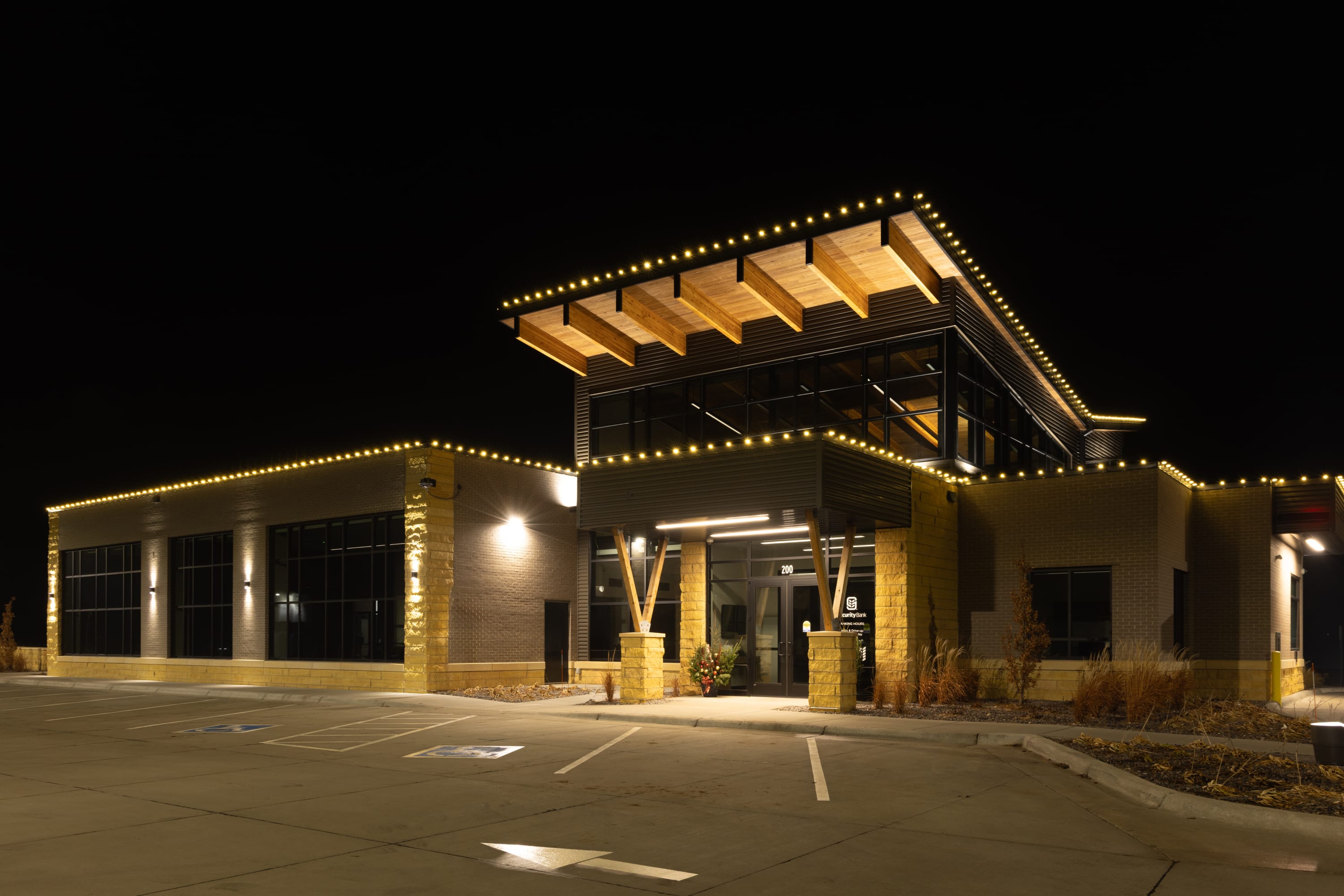 Commercial holiday lighting installation on a Sioux Falls area bank