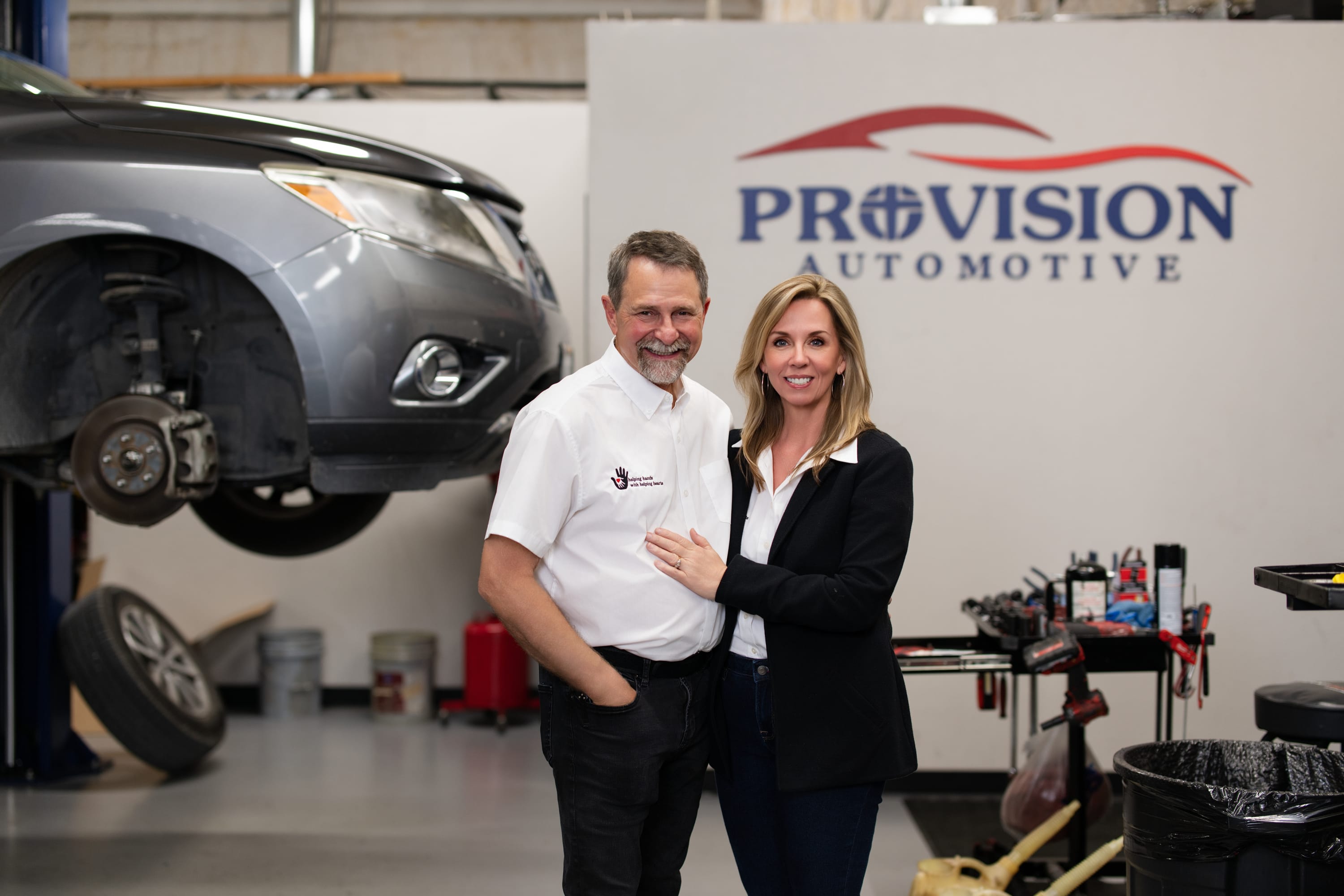 Gordy and Ronda Neuert, owners of Provision Automotive, standing in their auto repair shop in Melissa, TX