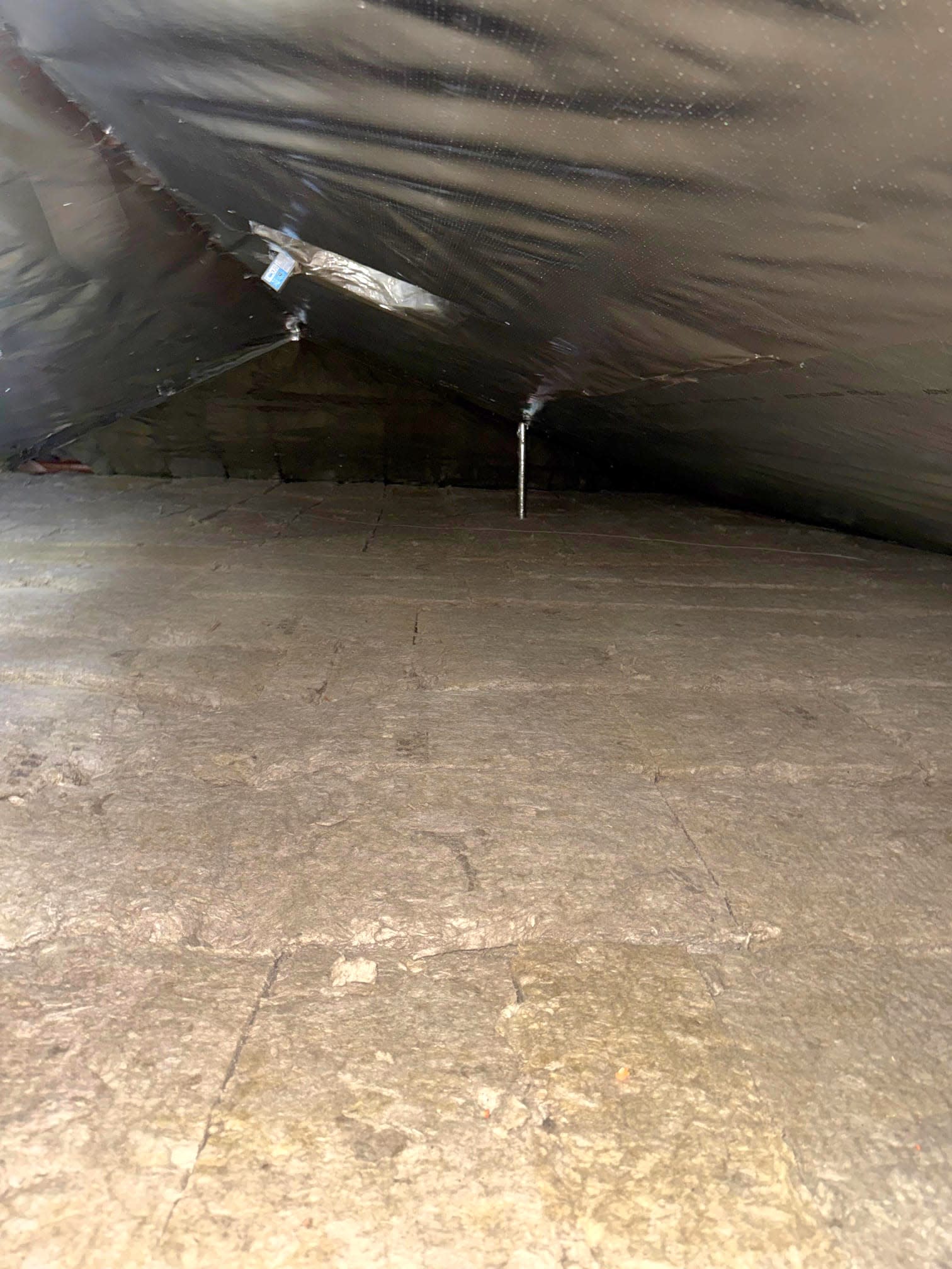 Rockwool insulation and radiant barrier installed in an attic to improve thermal protection and reduce heat transfer.