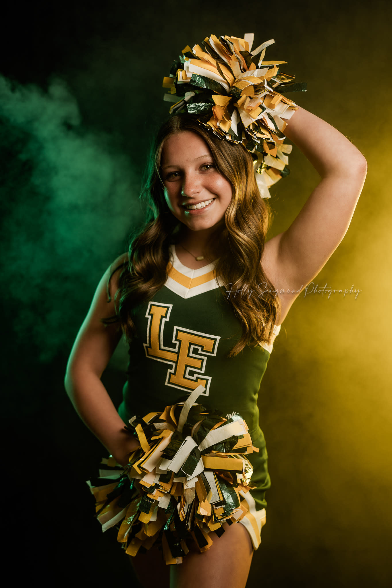 Sports Photography with lights and fog in school colors on black backdrop