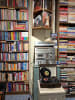 A collection of books, CDs, and records.