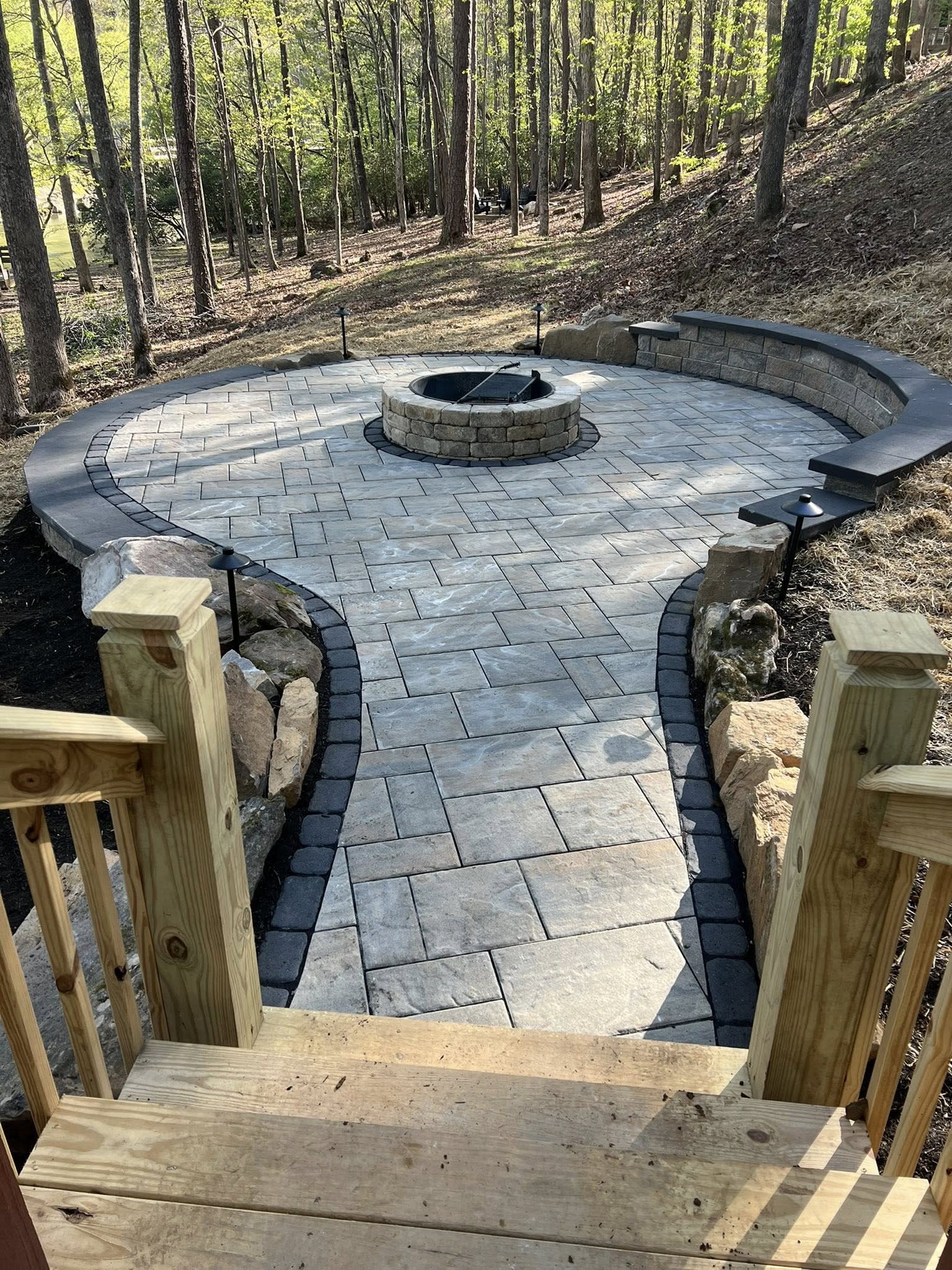 Paver patio and fire pit with retaining wall