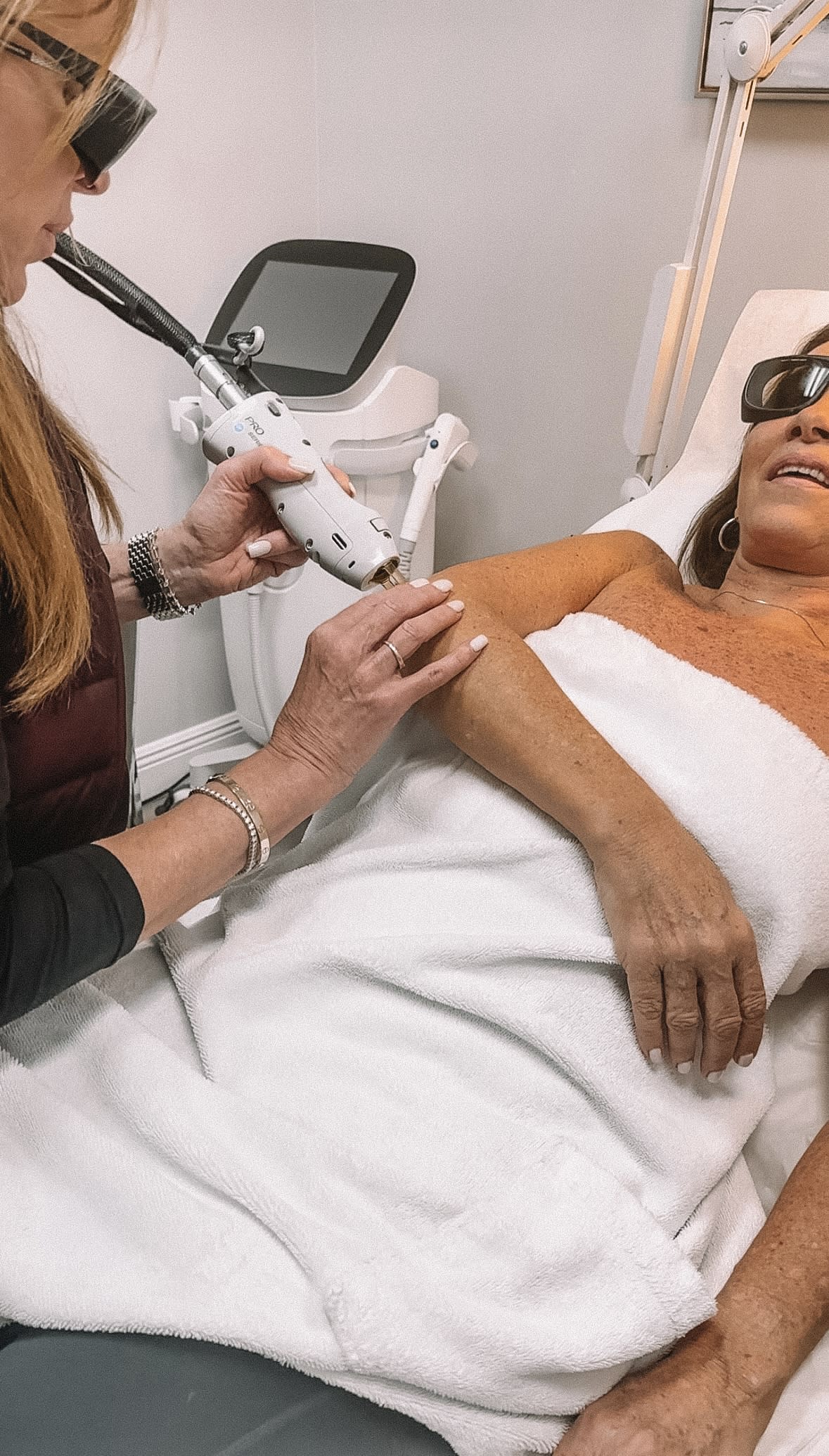 Patient receiving laser skin treatment on the arm at Refresh - Aesthetics & Wellness in Florida