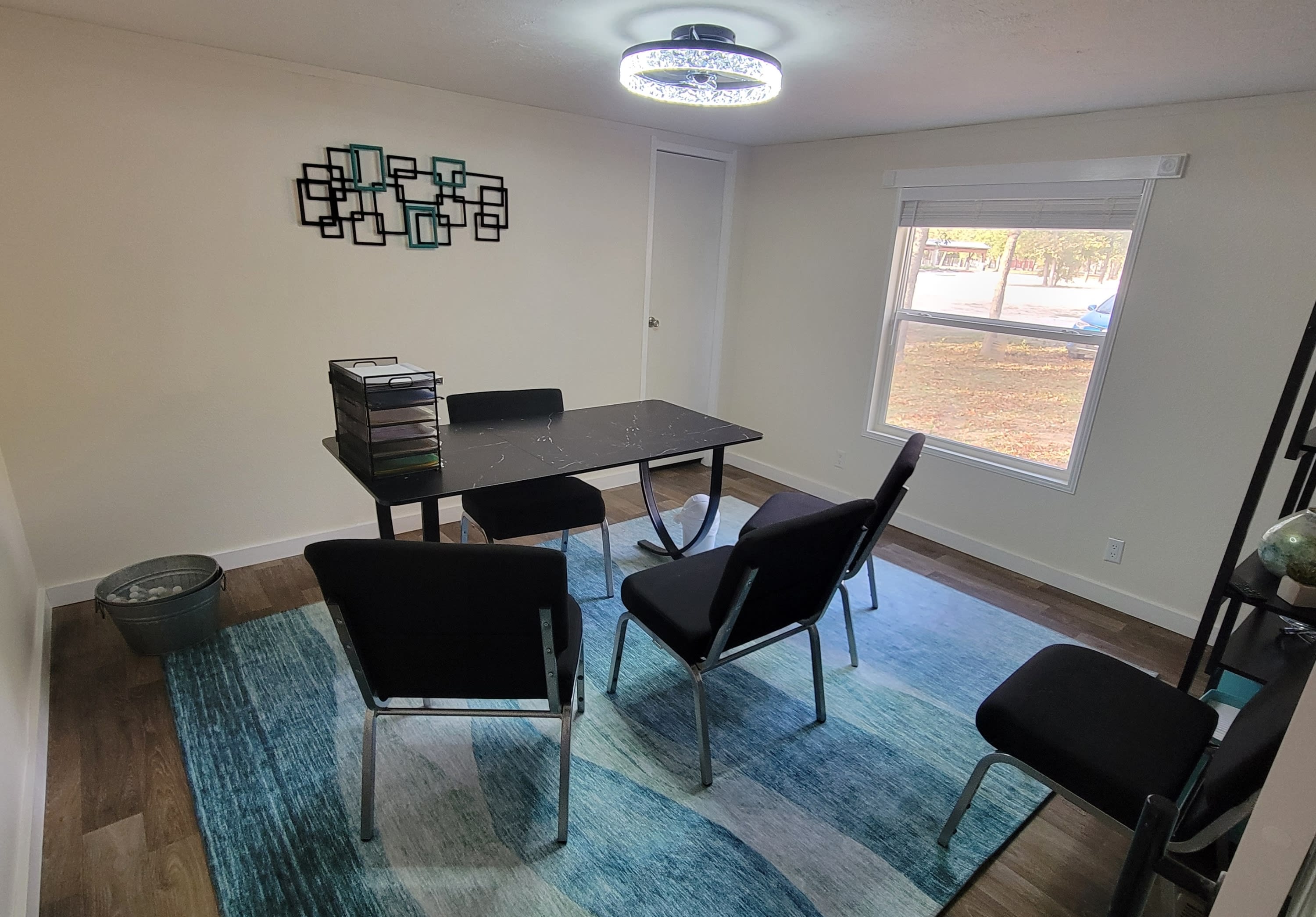 Private consultation room with table and seating for Donna Hall Wellness clients