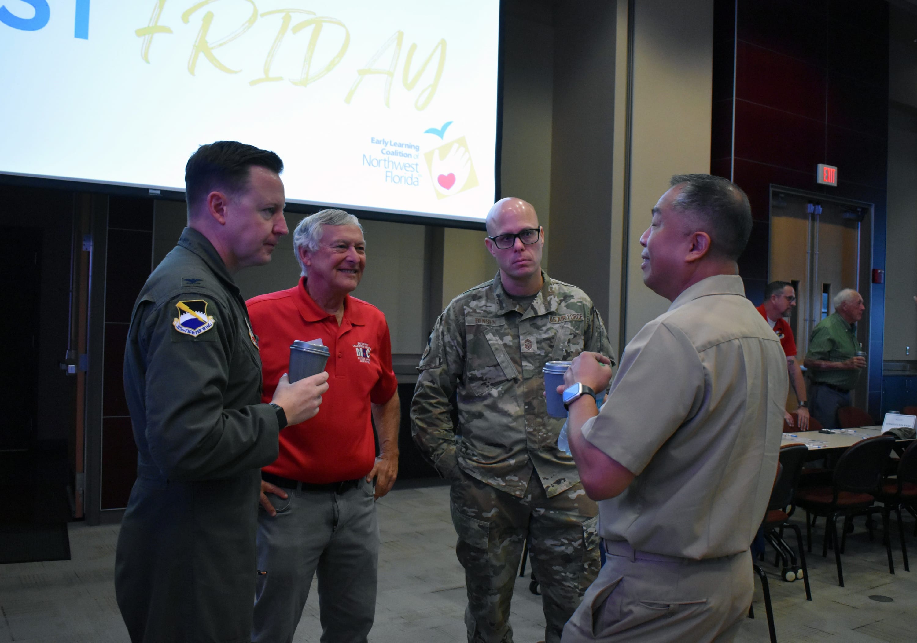 Military and community members talk during networking at the Bay County Chamber's October First Friday.