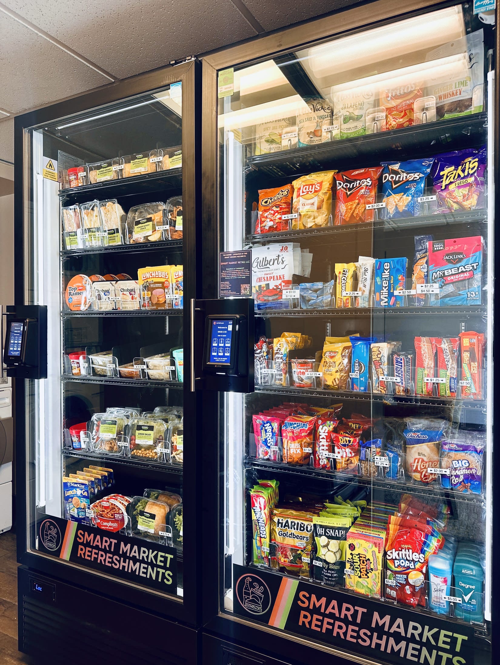 Two CoolSmart AI Markets with fresh food and elevated snacks