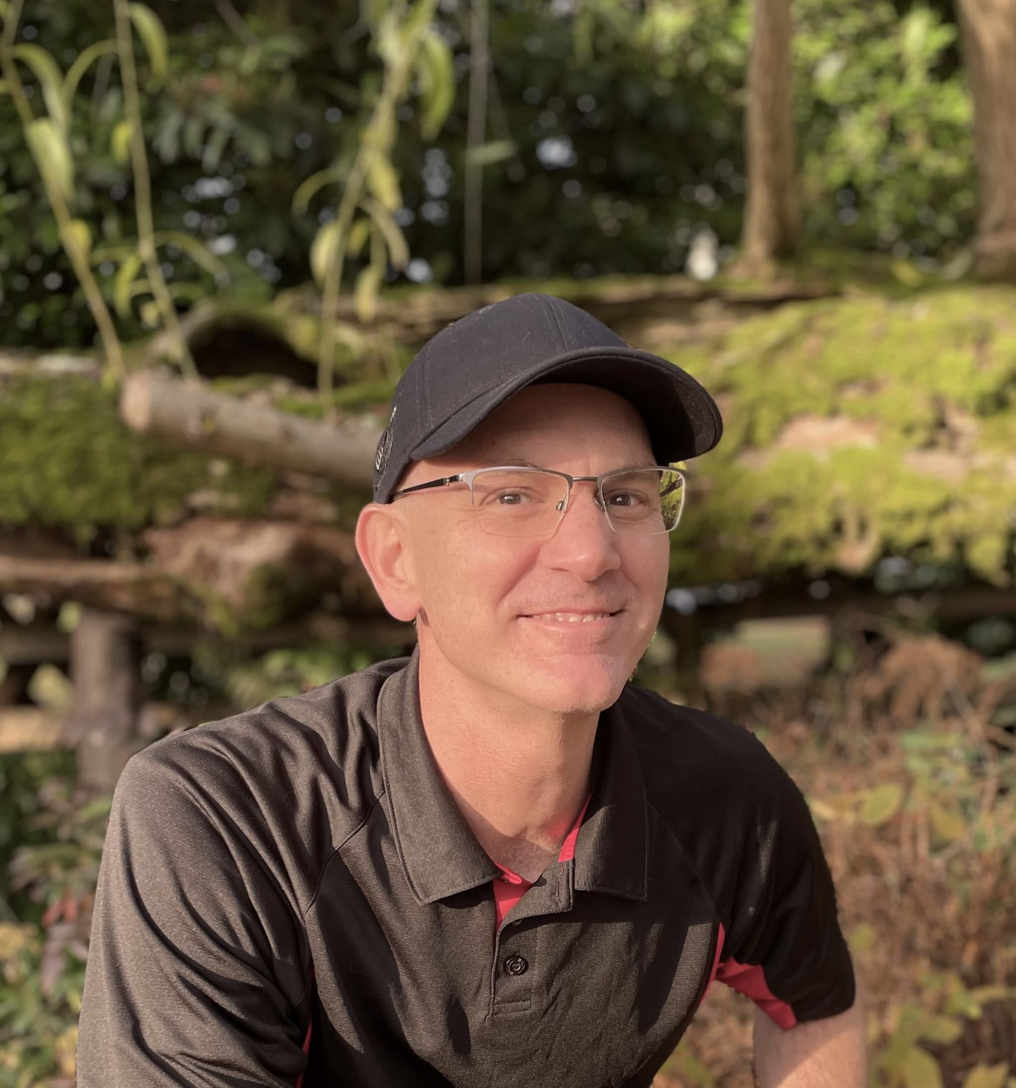 Headshot of Dr. Luke Patrick, casual with outdoor backdrop
